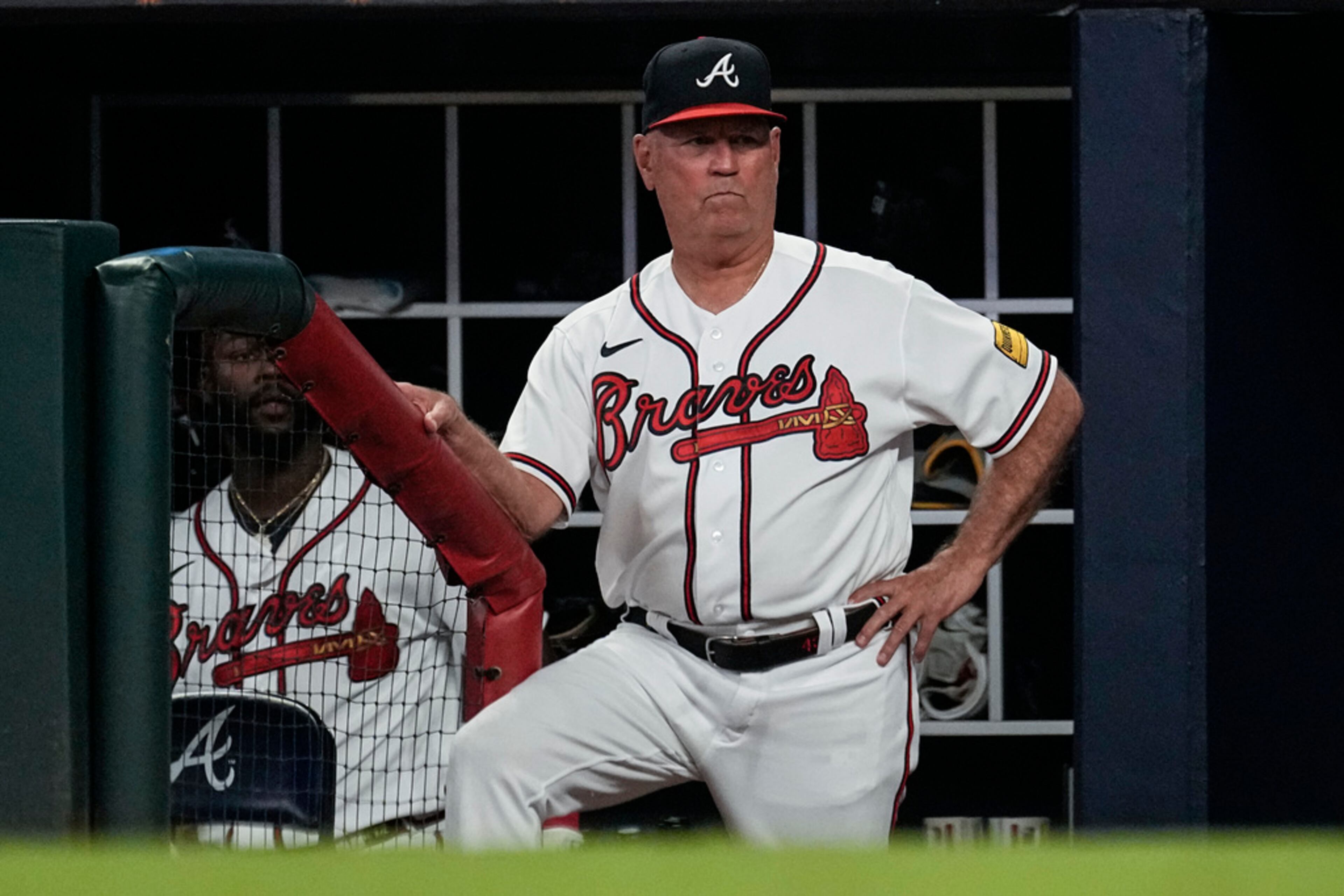 Atlanta Braves manager Brian Snitker watches from the dugout as the team plays against the Minnesota Twins in a baseball game Tuesday, June 27, 2023, in Atlanta. (AP Photo/John Bazemore)