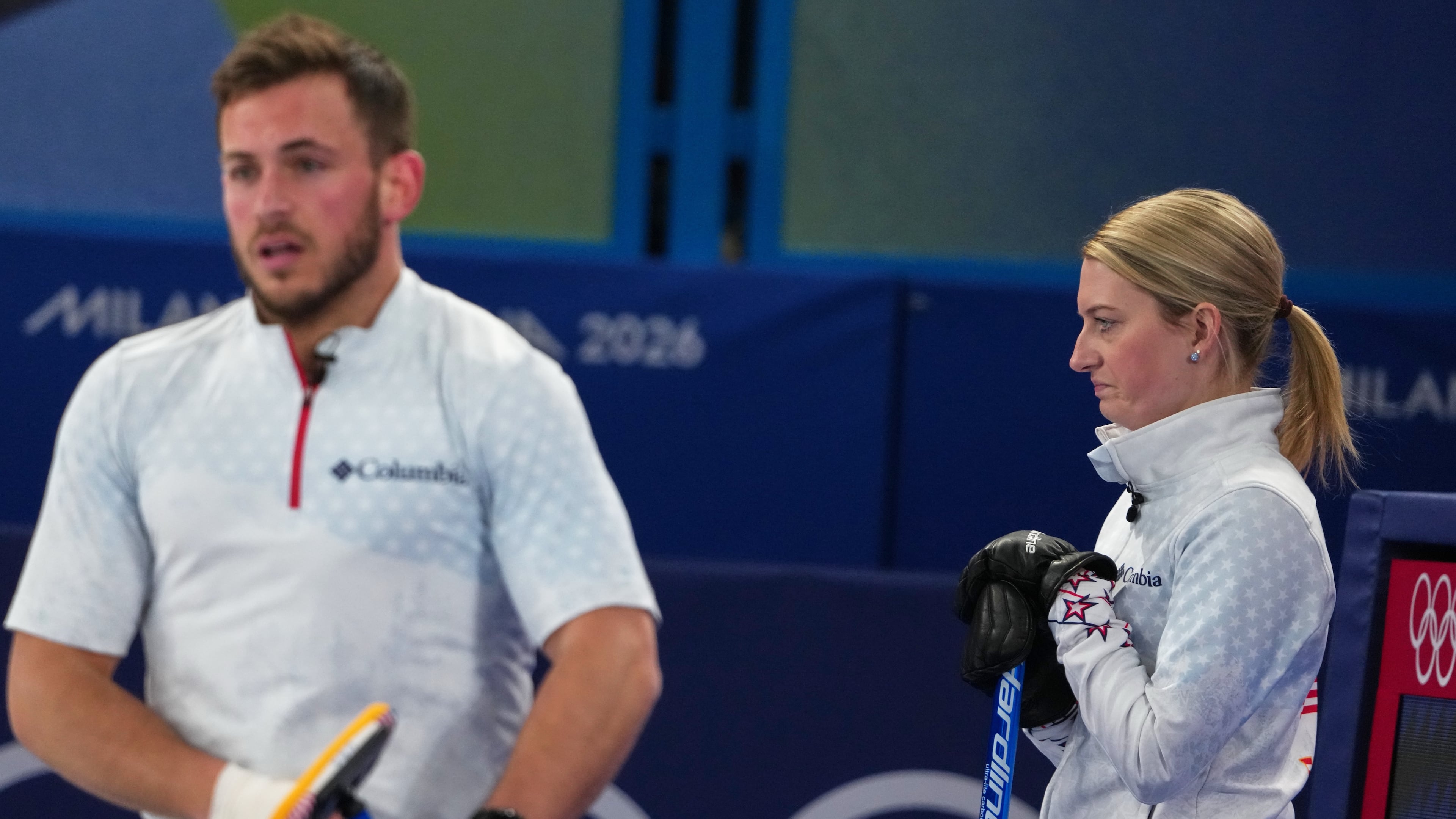 United States' Cory Thiesse and Korey Dropkin look on during the mixed doubles round robin phase of the curling competition against Britain, at the 2026 Winter Olympics, in Cortina d'Ampezzo, Italy, Saturday, Feb. 7, 2026. (AP Photo/Misper Apawu)