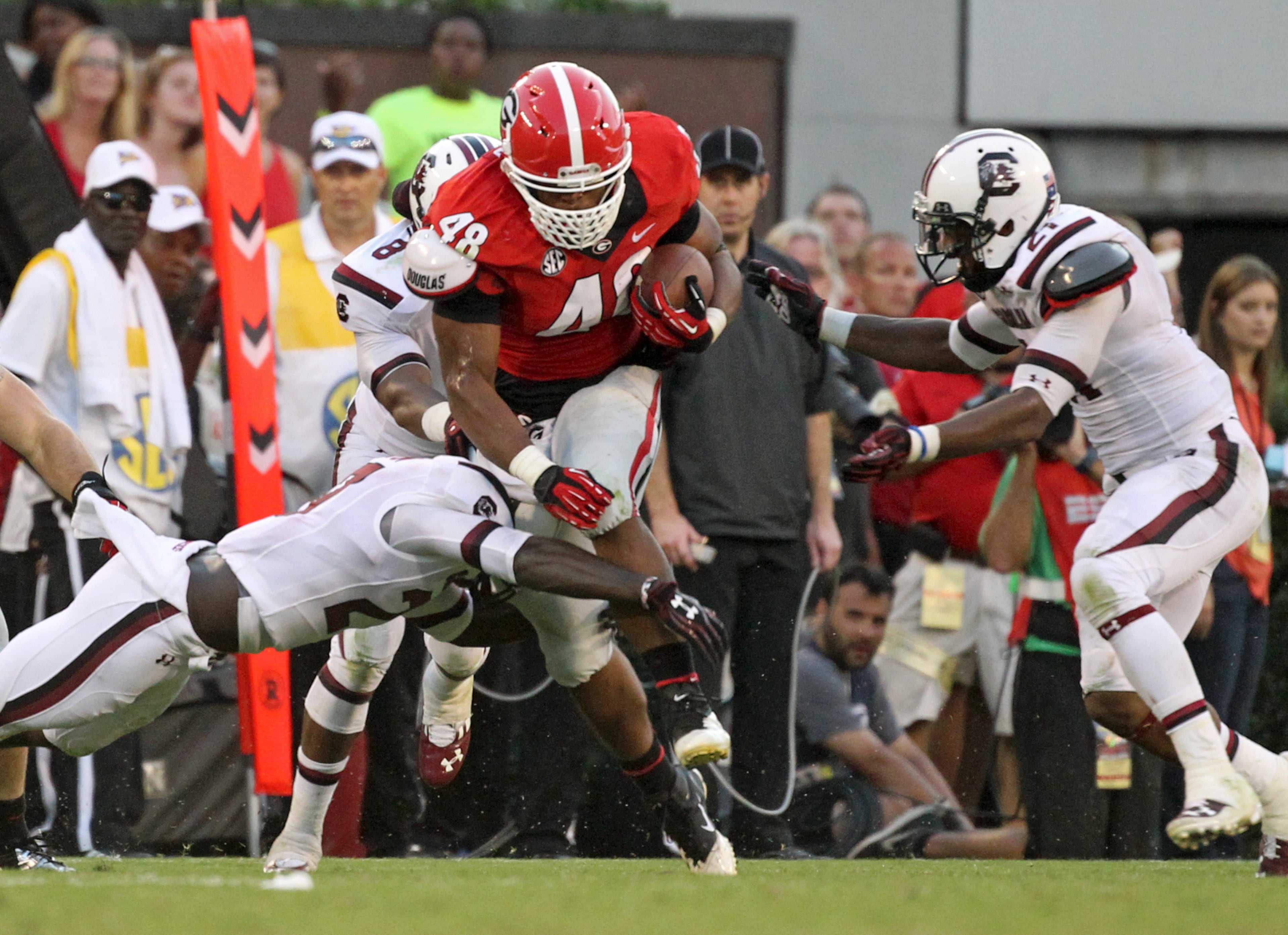 Georgia fullback Quayvon Hicks (48) runs for a first down after a catch from quarterback Aaron Murray during Georgia's win over South Carolina Saturday afternoon in Athens, Ga., September 7, 2013. JASON GETZ / JGETZ@AJC.COM