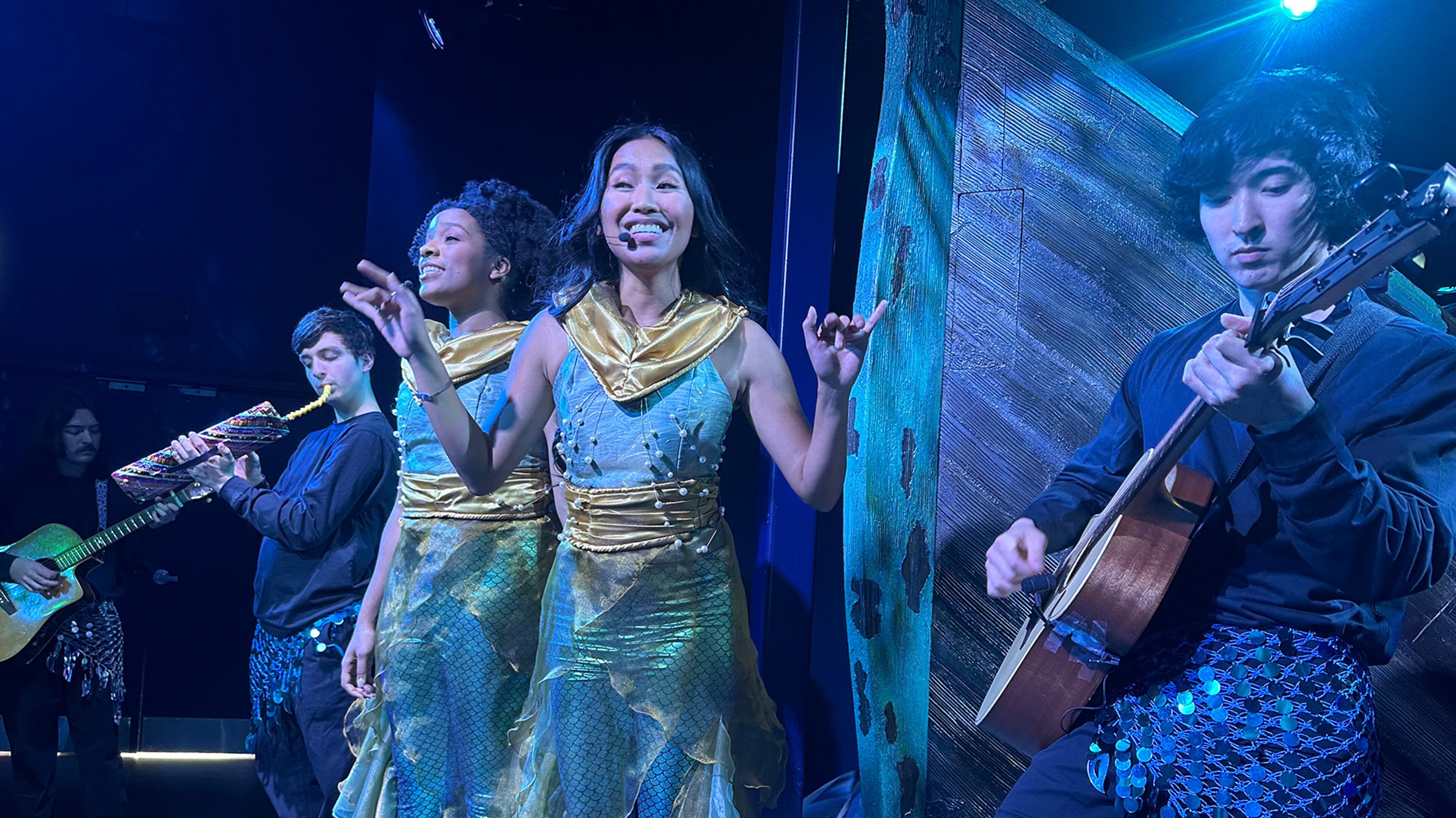 Monica Ortiz (center) sings "Under the Sea" with the rest of the musical crew of mer-persons at "The Little Mermaid" experience at CAMP in Dunwoody, during a test run on May 30, 2023, four days before official opening. RODNEY HO/rho@ajc.com