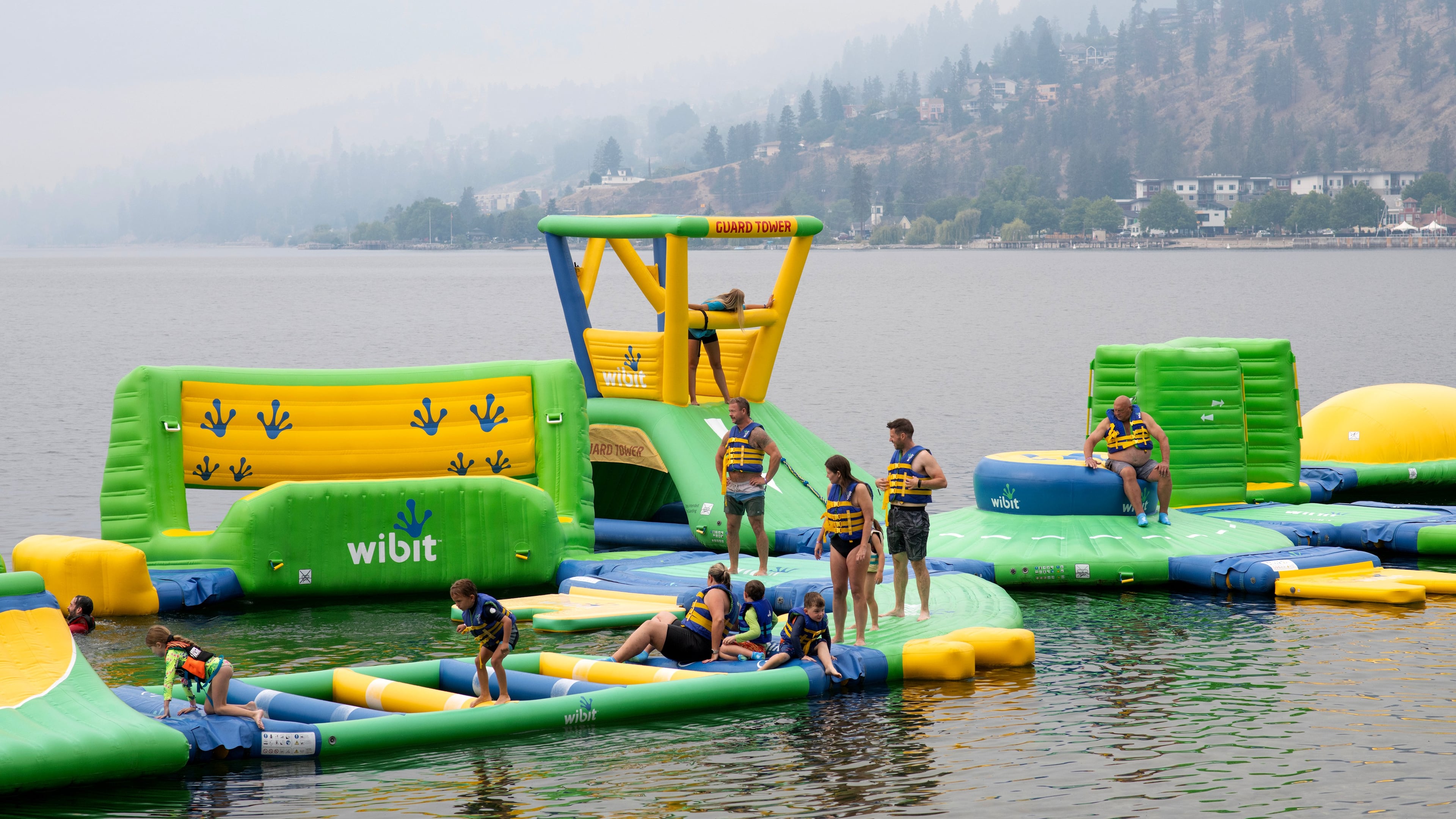 People play at the Peachland Water Park in Peachland, British Columbia, Canada, on Saturday, Aug. 8, 2026. (Gary Nylander/The Canadian Press via AP)