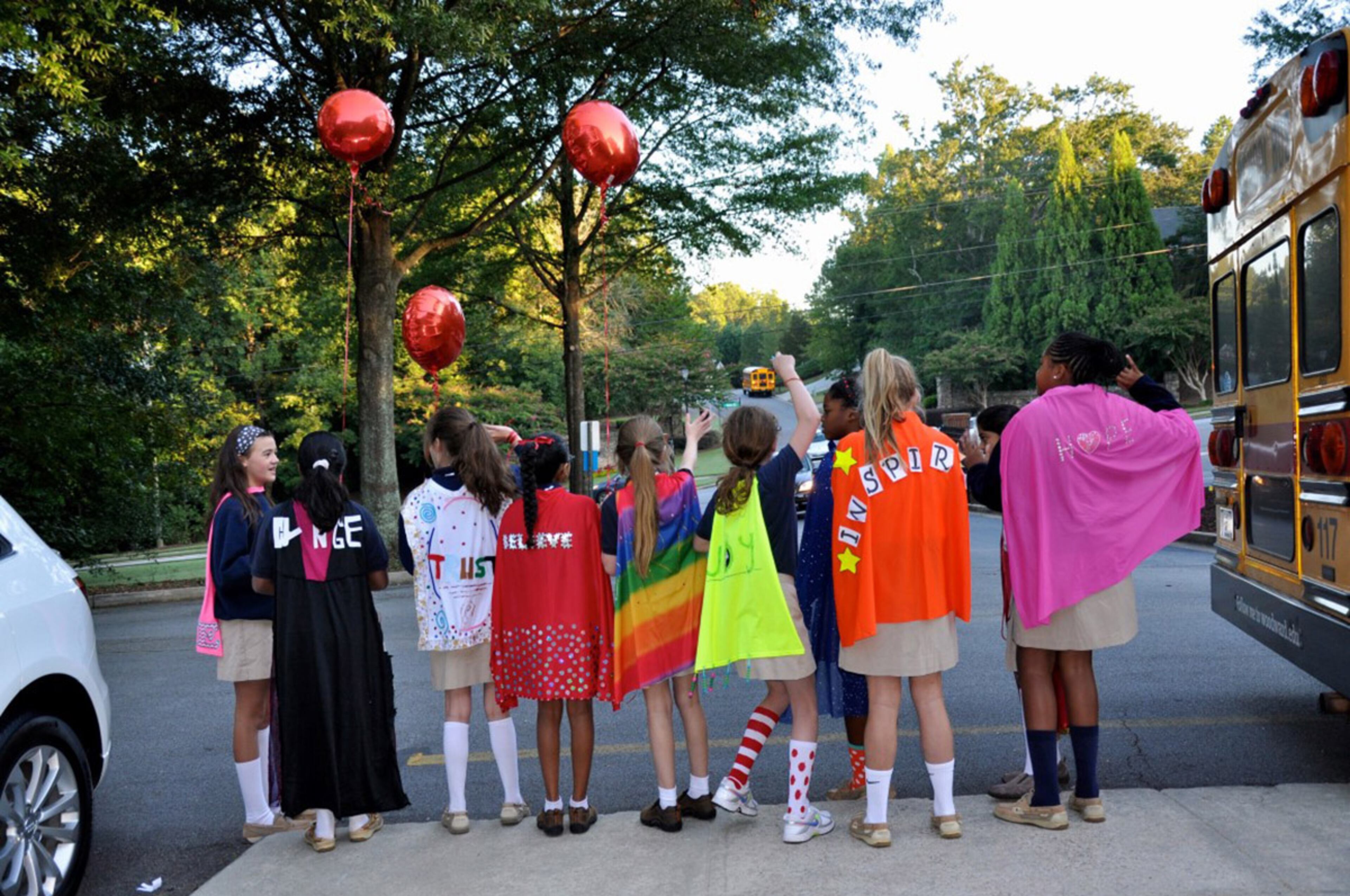 Woodward Academy’s Woodward North campus in Johns Creek showed its support for #CapeDayATL. These sixth-graders wore their capes to school Tuesday. Courtesy of Kristin Chapman