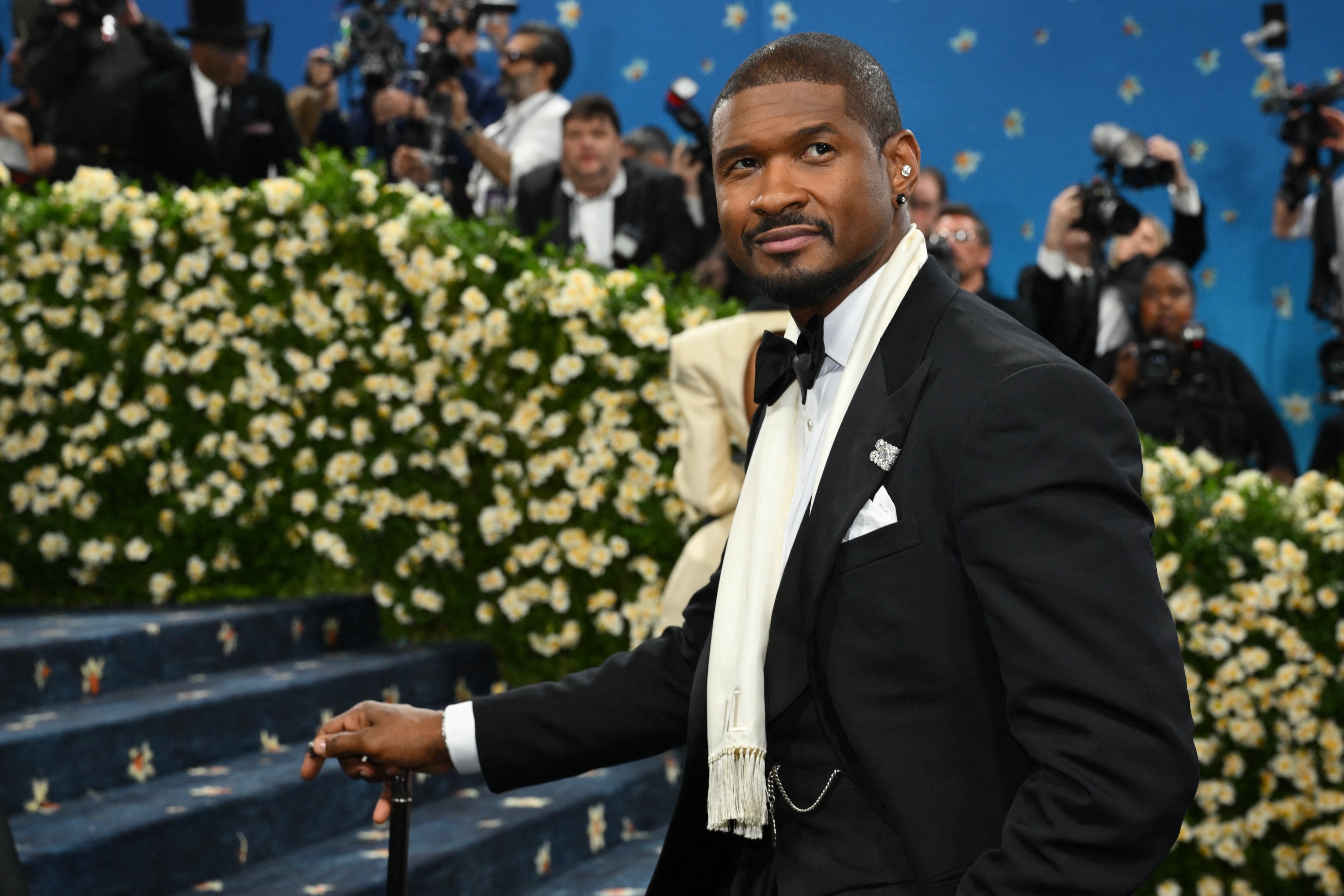 US singer-songwriter Usher arrives for the 2025 Met Gala at the Metropolitan Museum of Art on May 5, 2025, in New York. The Gala raises money for the Metropolitan Museum of Art's Costume Institute. The 2025 Met Gala is themed "Tailored for You," aligning with the Costume Institute's exhibition, "Superfine: Tailoring Black Style," set to open to the public on May 10. (Photo by Angela WEISS / AFP) (Photo by ANGELA WEISS/AFP via Getty Images)