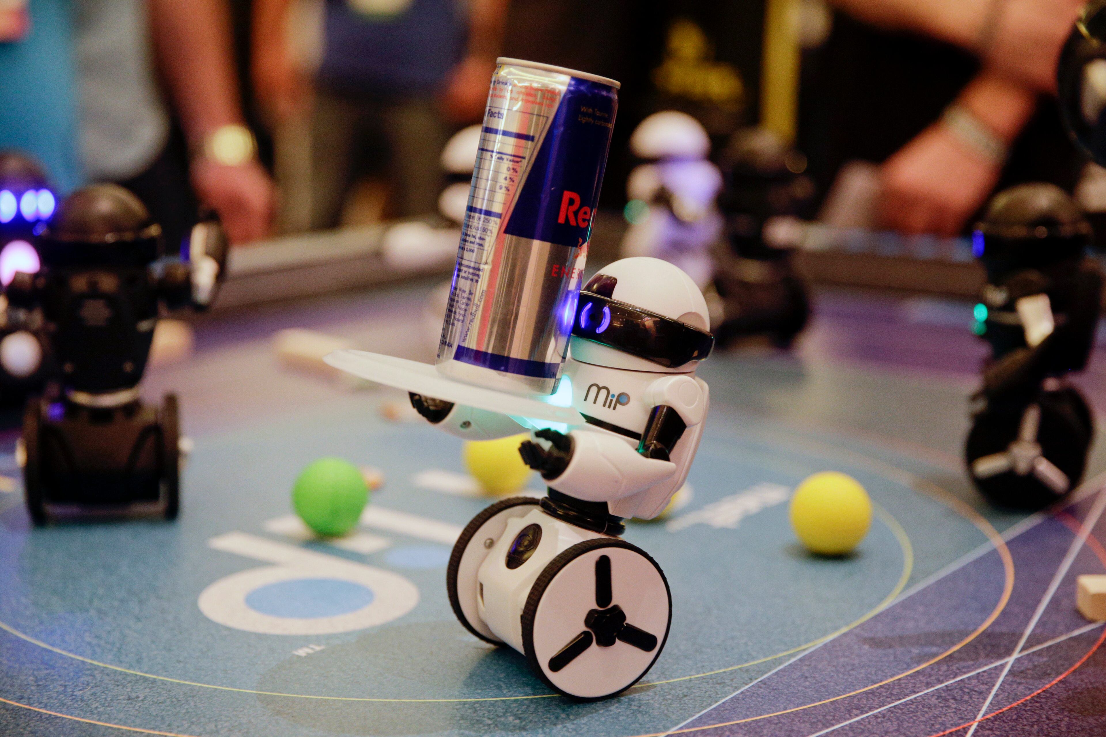 WowWee's MiP, a balancing robot that can be controlled by hand motions or smartphones, carries a can of energy drink at the International Consumer Electronics Show on Wednesday, Jan. 8, 2014, in Las Vegas. (AP Photo/Jae C. Hong)