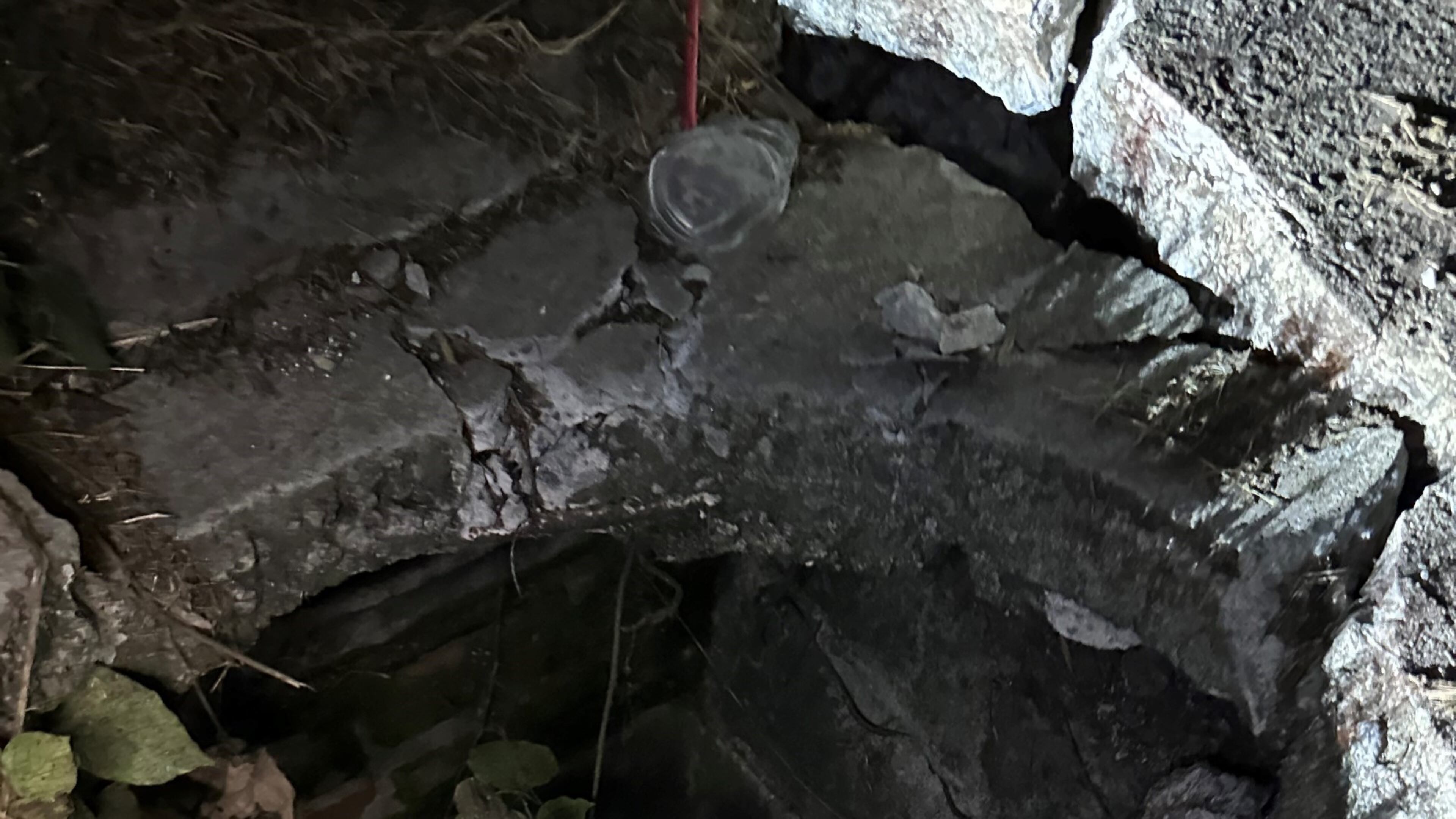 Driver Camryn Walsh fell all the way into this open manhole on the Cascade Road ramp to I-285/southbound in Southwest Atlanta. Credit: Jake Walsh