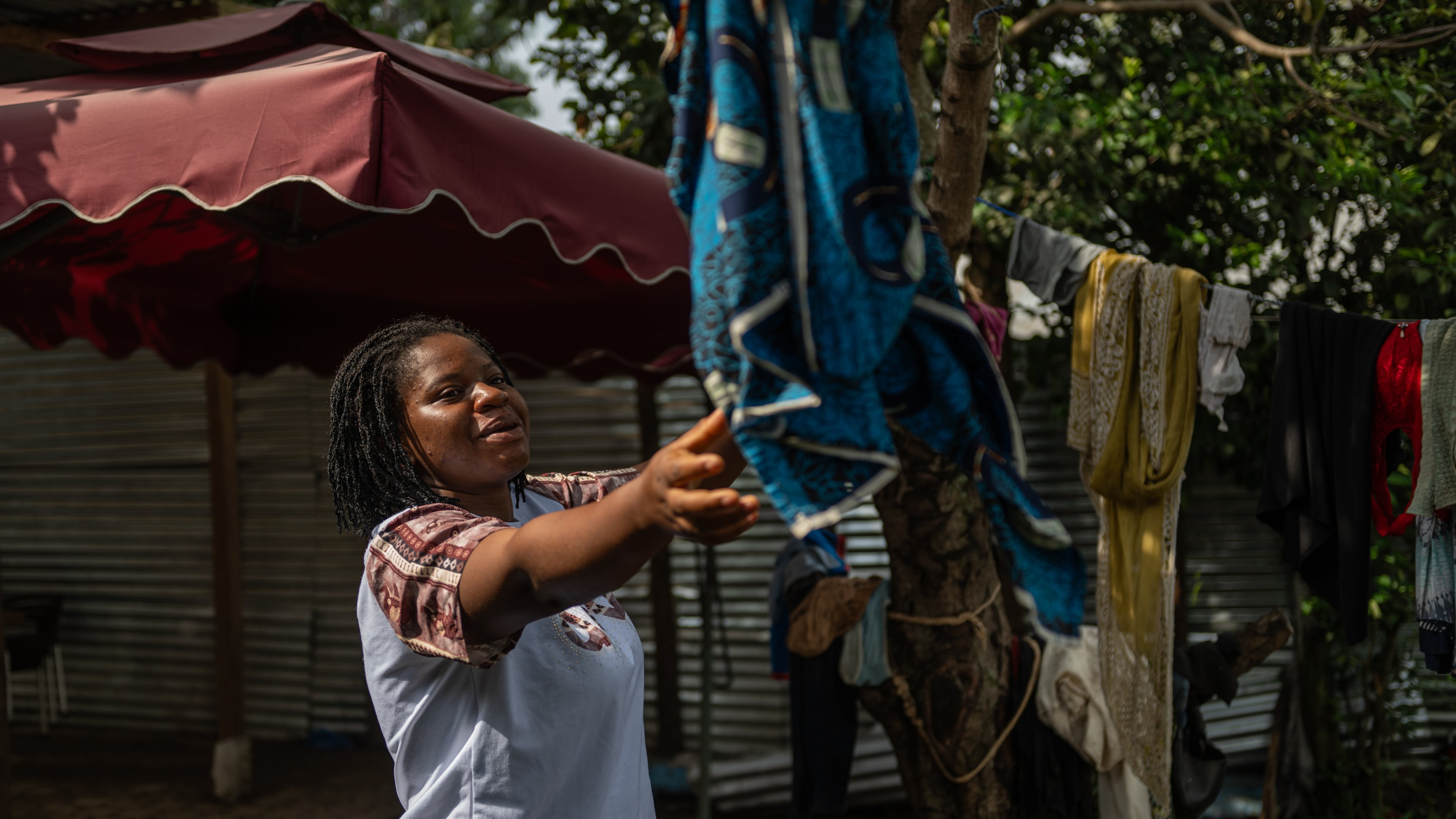 Esther Lutula, a 26 year-old woman who is four months pregnant and a mother of four who stopped going for prenatal checkups shortly after the current Ebola outbreak, does the laundry outside her house in Bunia, northeastern, Congo, Tuesday, June 16, 2026. (AP Photo/Moses Sawasawa)