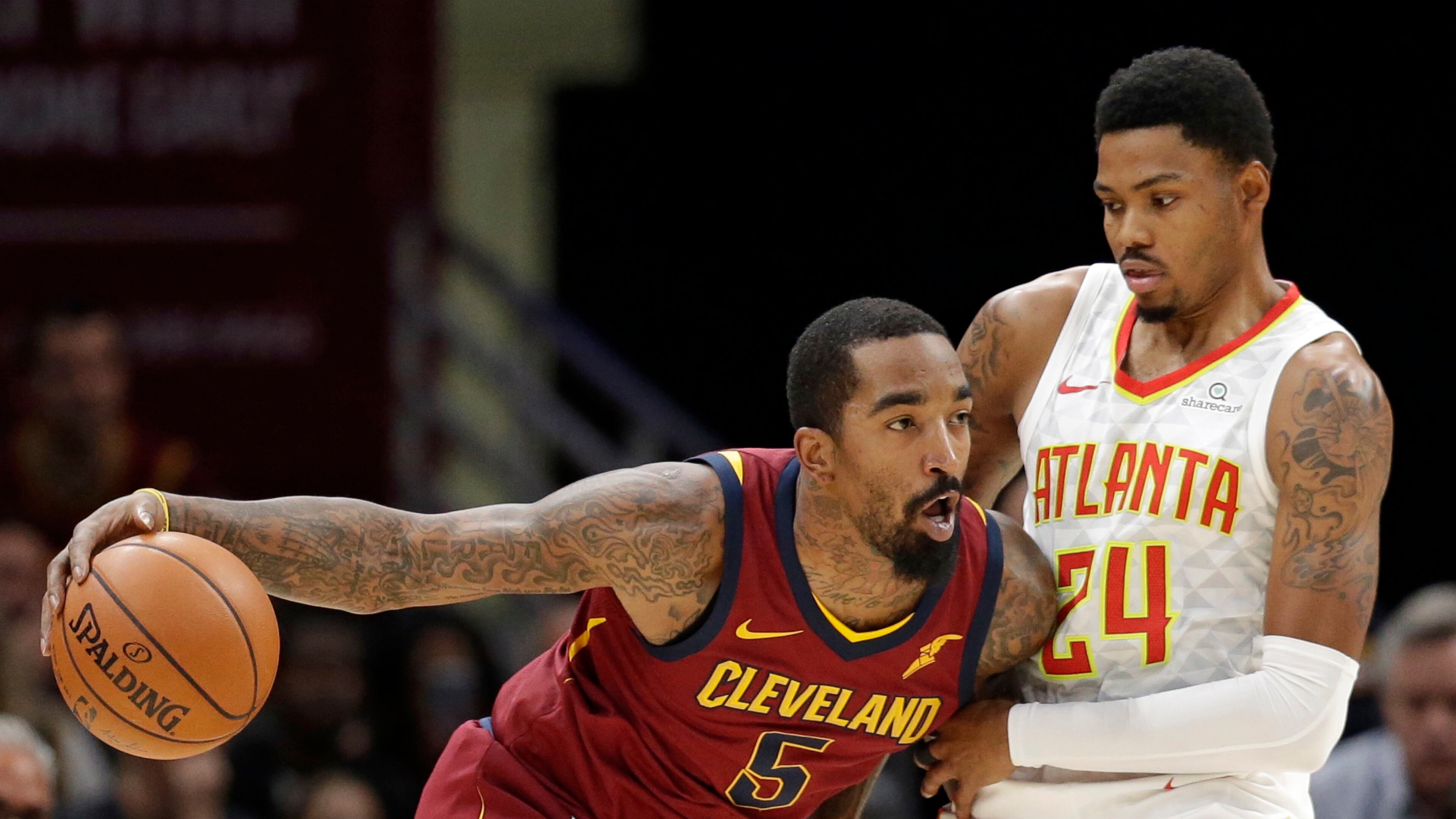 Cleveland Cavaliers' JR Smith (5) drives against Atlanta Hawks' Kent Bazemore (24) in the first half of an NBA basketball game, Sunday, Nov. 5, 2017, in Cleveland. (AP Photo/Tony Dejak)