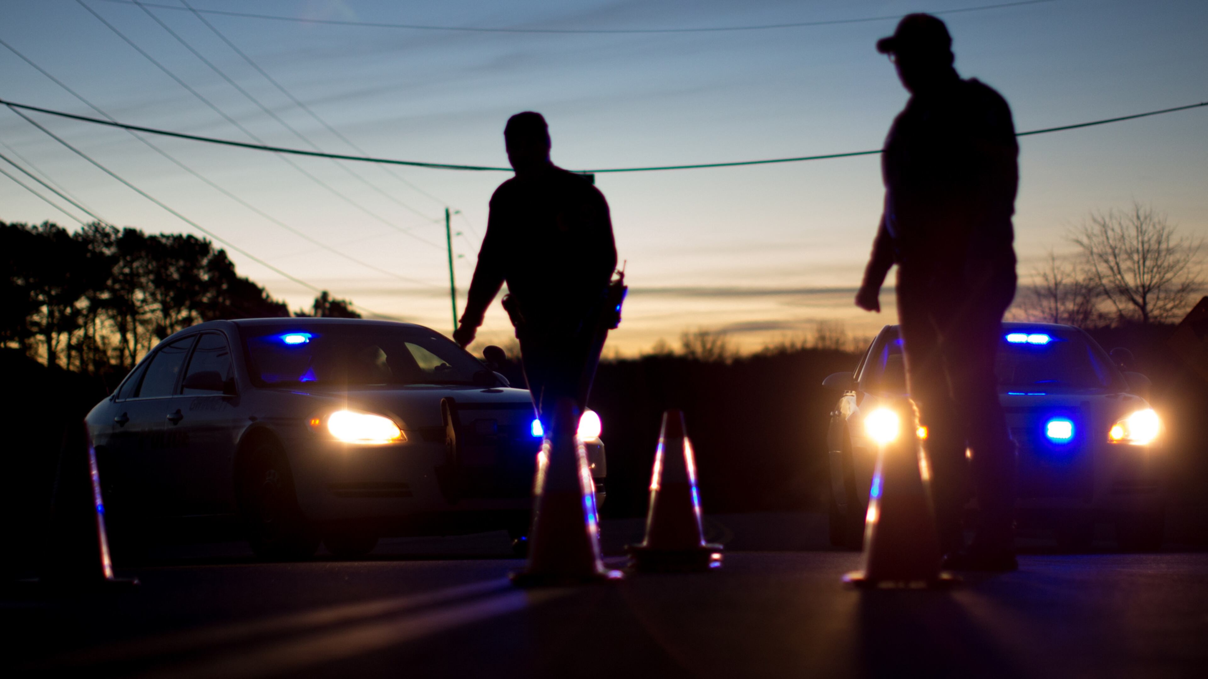 ROAD BLOCK--Gwinnett County Police officers block a road near the scene of a hostage situation near Beyers Landing Drive, Wednesday, Jan. 6, 2016, in Buford, Ga. The Gwinnett County SWAT team is in a standoff with an armed man who is holding a 2-year-old hostage in a Buford neighborhood. BRANDEN CAMP/SPECIAL