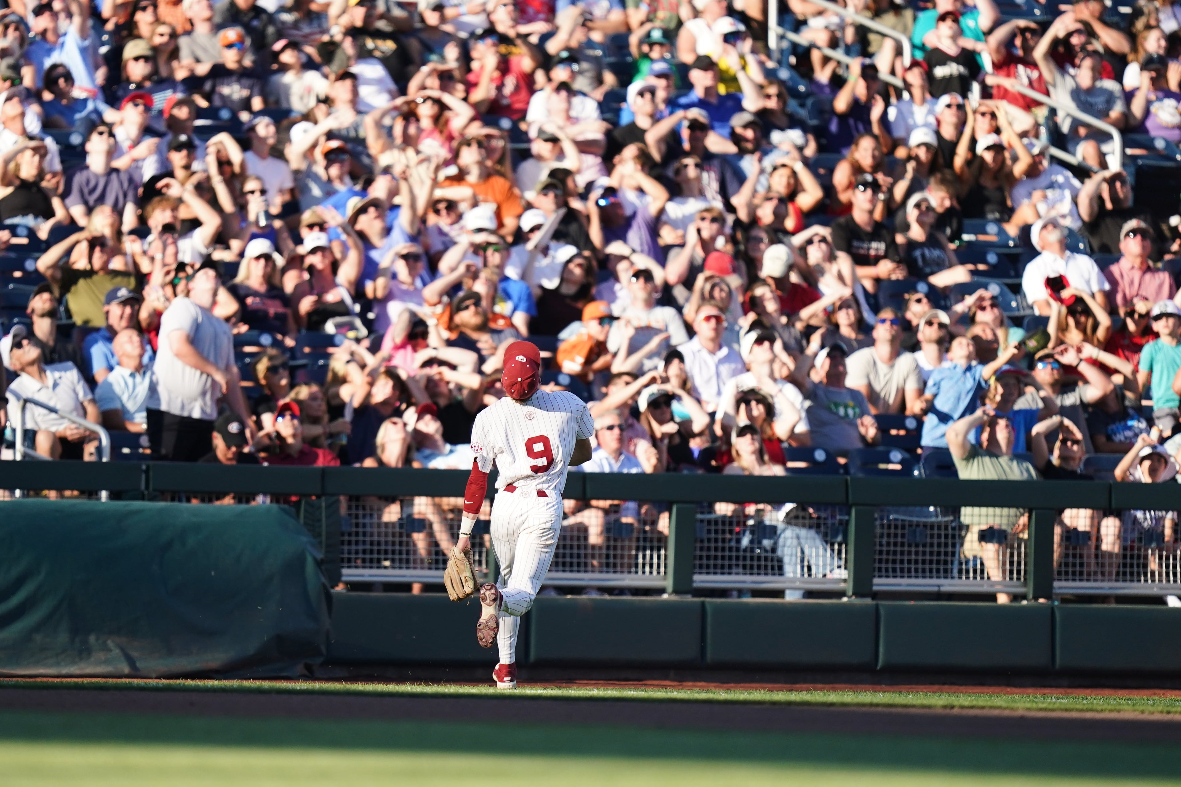 Oklahoma infielder Camden Johnson watches the ball fly out of play during a College World Series game against Georgia on Monday, June 15, 2026, in Omaha, Neb. (Vera Nieuwenhuis/AP)