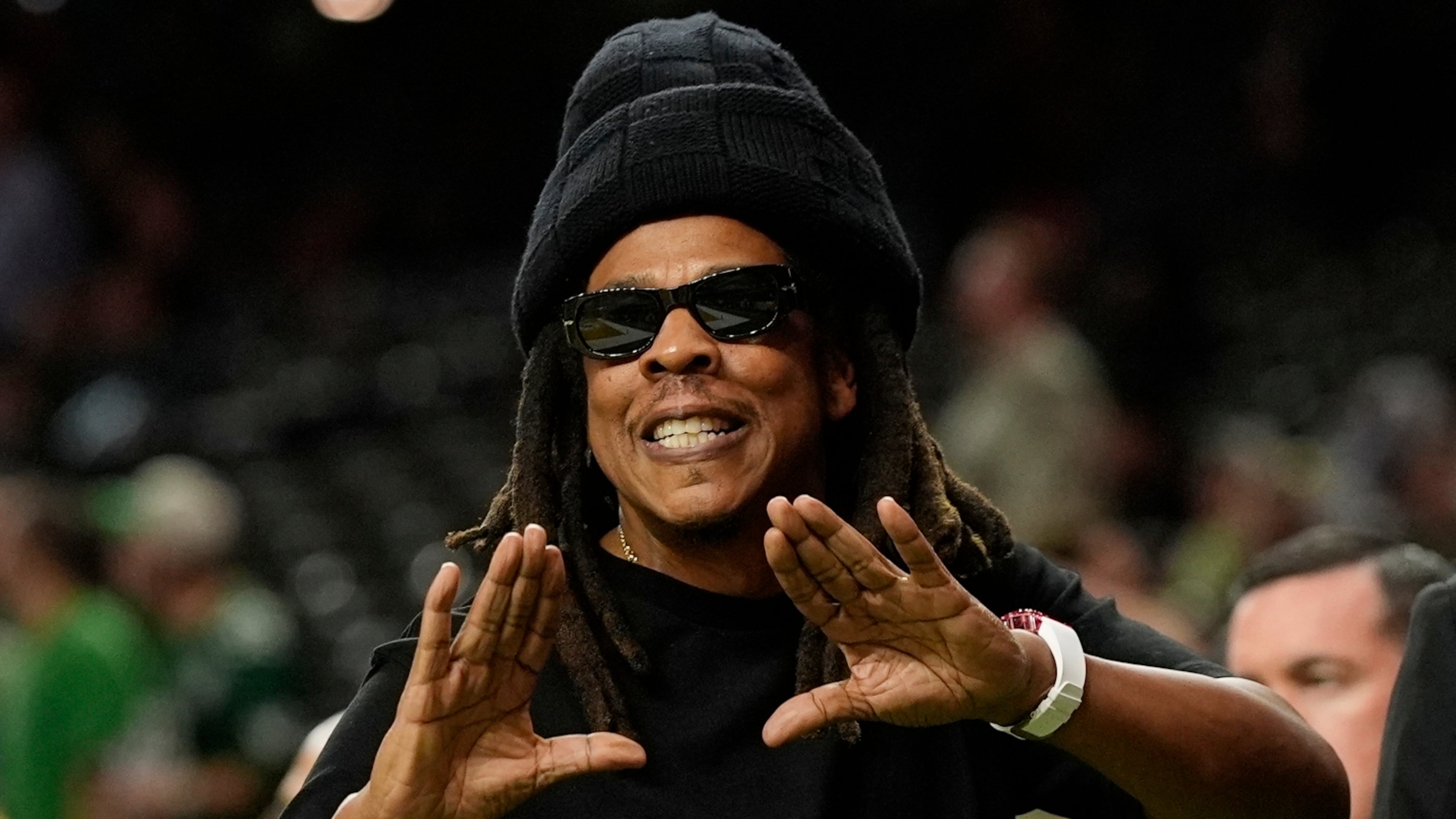 FILE - Jay-Z gestures from the sidelines prior to the NFL Super Bowl 59 football game, Feb. 9, 2025, in New Orleans. (AP Photo/Frank Franklin II, File)