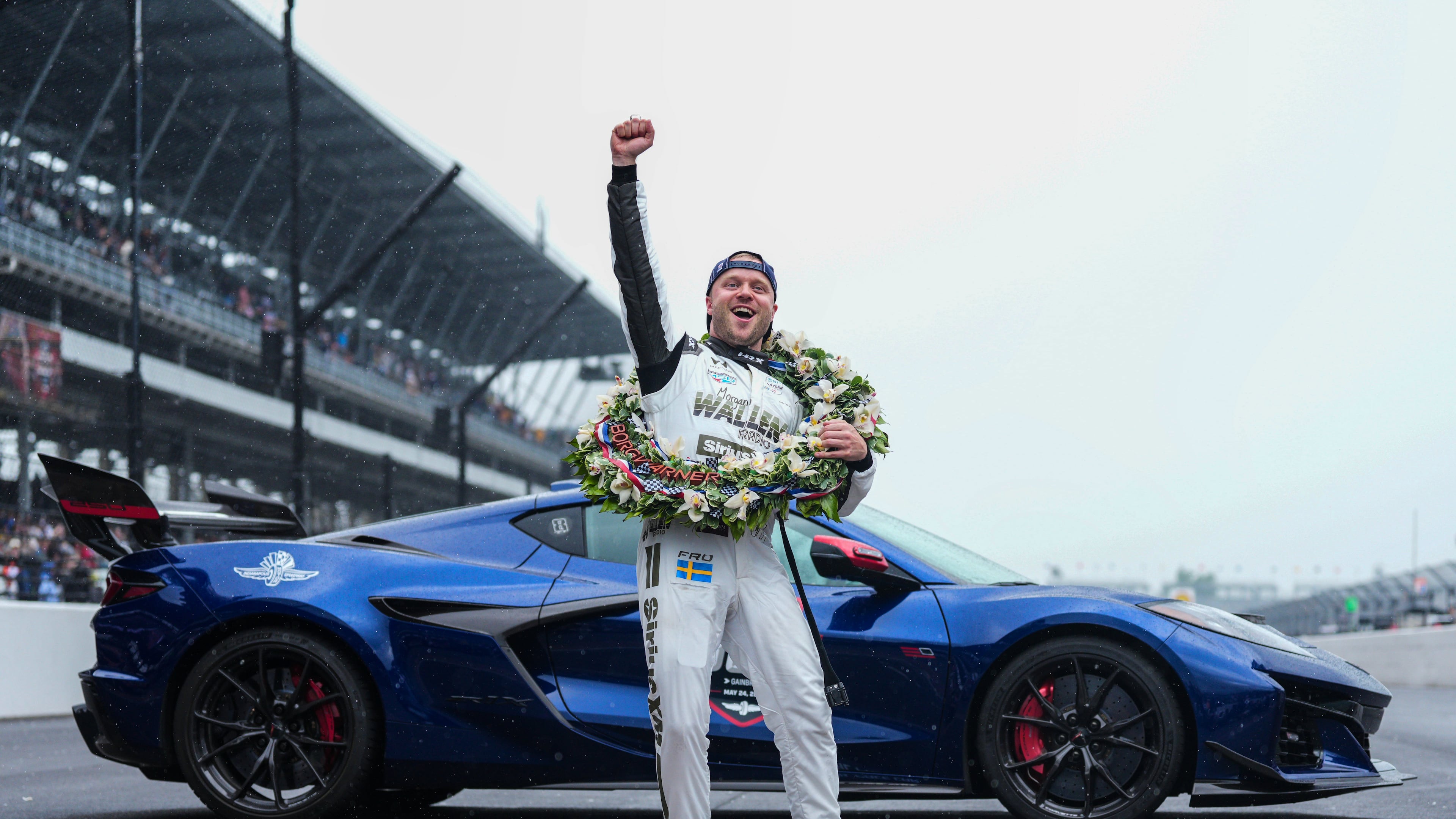 Felix Rosenqvist, of Sweden, pumps his fist at the request of track officials after winning the Indianapolis 500 auto race at Indianapolis Motor Speedway, Sunday, May 24, 2026 in Indianapolis. (AP Photo/AJ Mast)