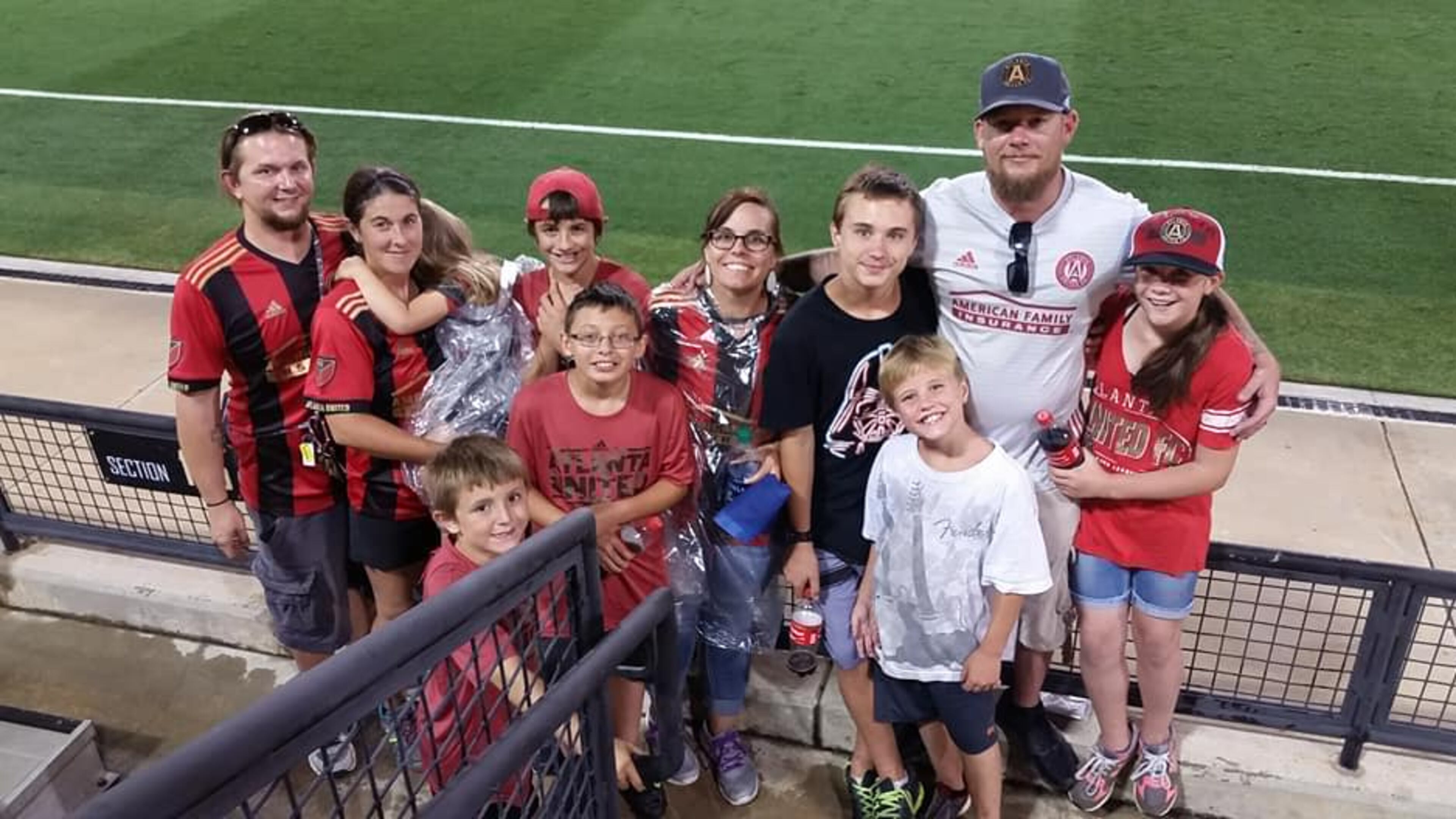 Atlanta United fan Josh Proctor with friends and family at an Atlanta United game.