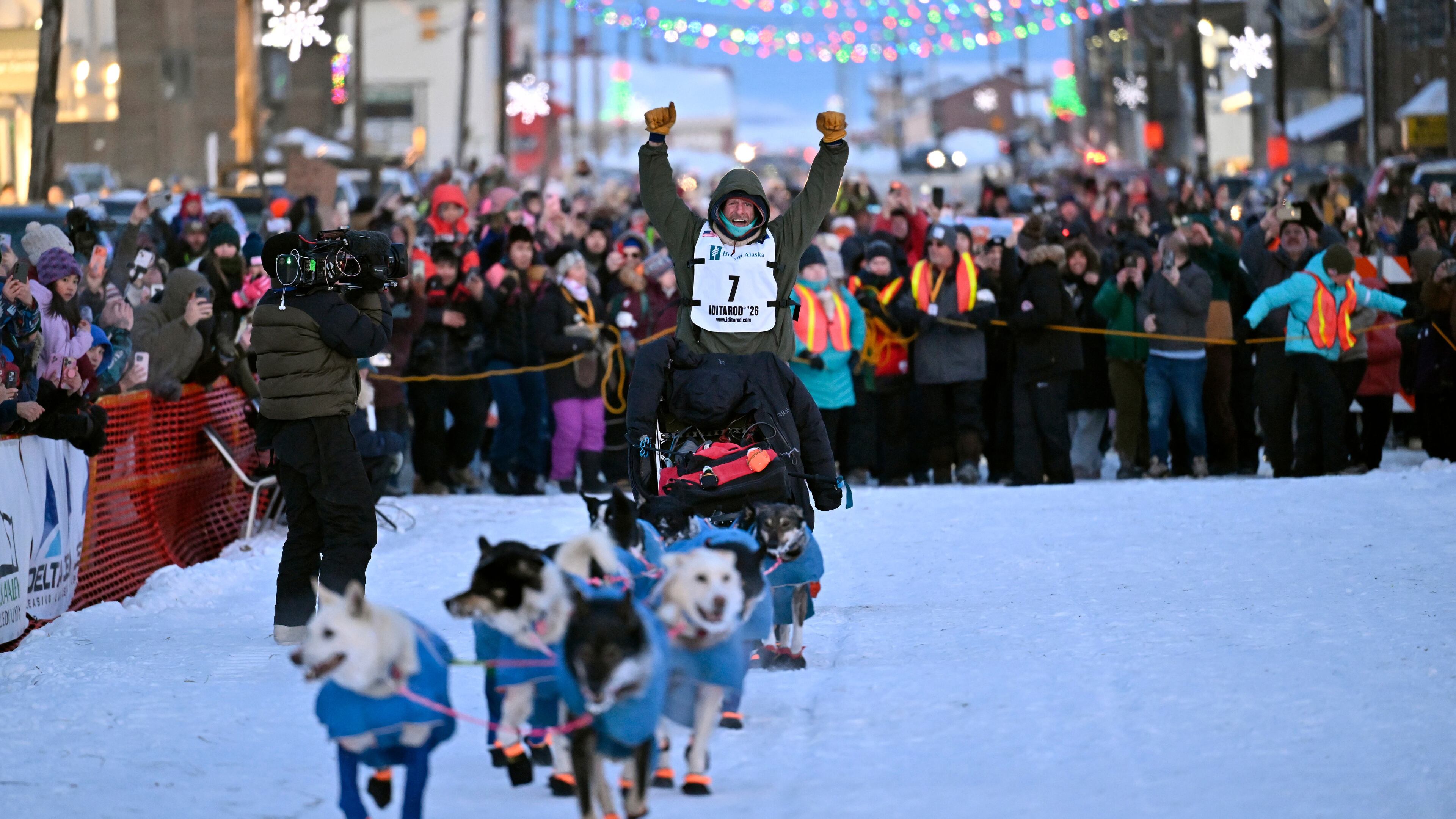 Jessie Holmes arrives first to the finish lane, claiming his second straight Iditarod Trail Sled Dog Race championship, in Nome, Alaska, Tuesday March 17, 2026. (Marc Lester/Anchorage Daily News via AP)