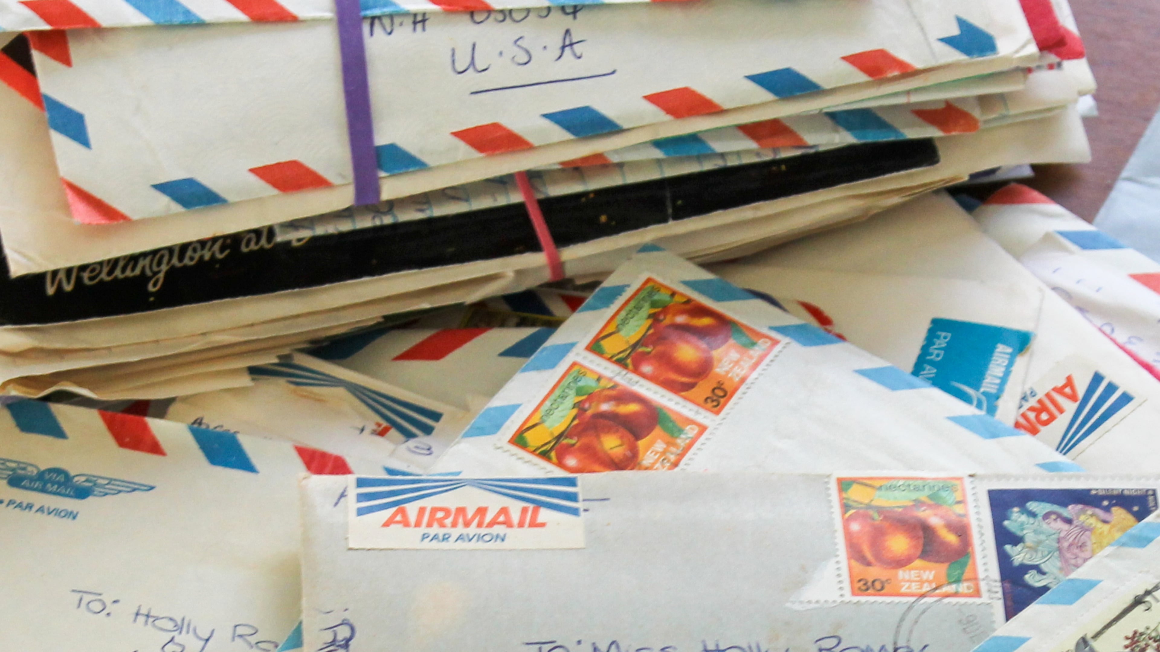 Some of the hundreds of letters AP reporter Holly Ramer has received from her pen pal in New Zealand are displayed in Bow, N.H., Thursday, April 9, 2026. (AP Photo/Holly Ramer)
