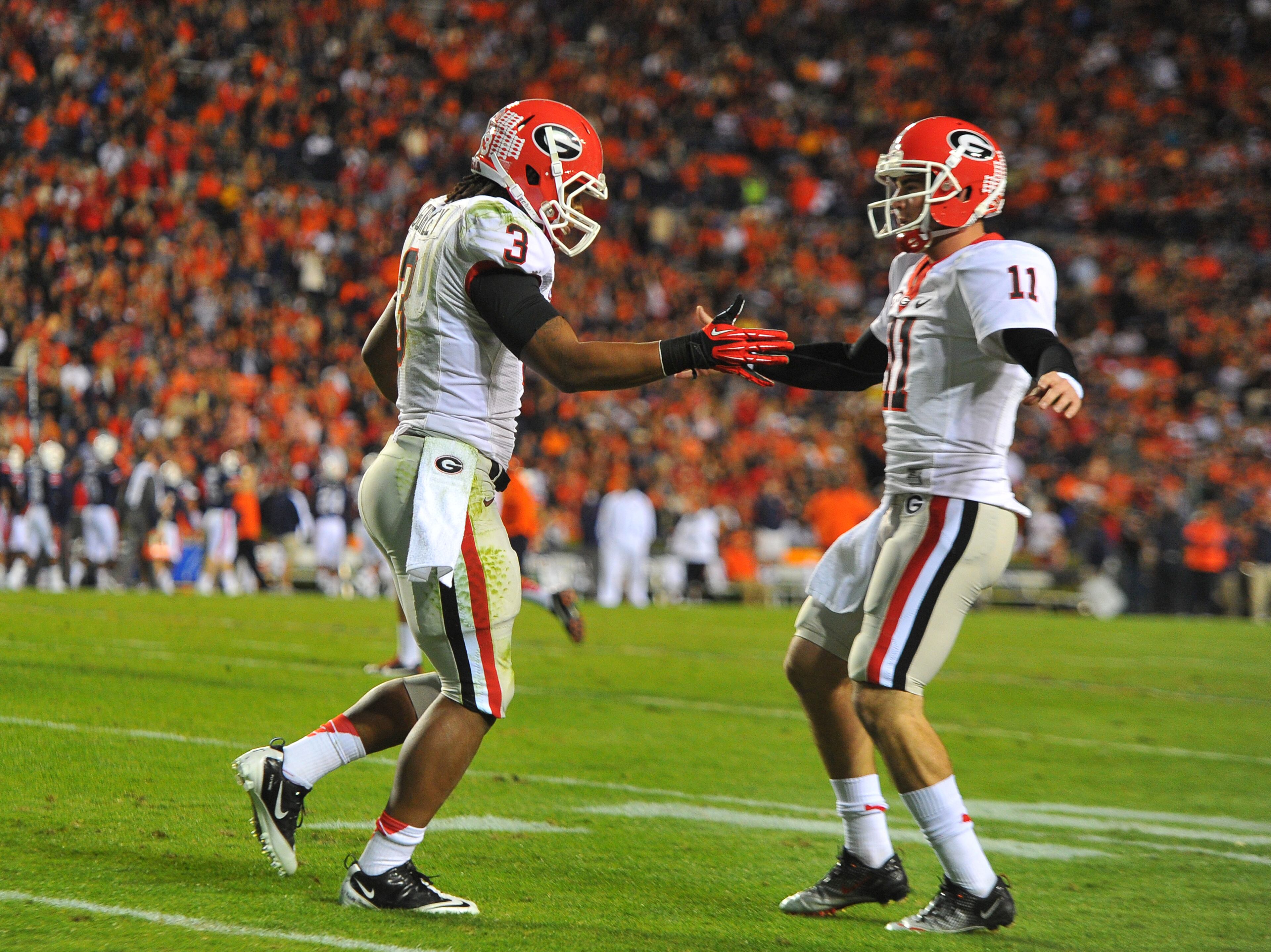 Quarterback Aaron Murray, right, and running back Todd Gurley celebrate Gurley's second quarter touchdown against Auburn at Jordan-Hare Stadium in Auburn Saturday November 10, 2012.