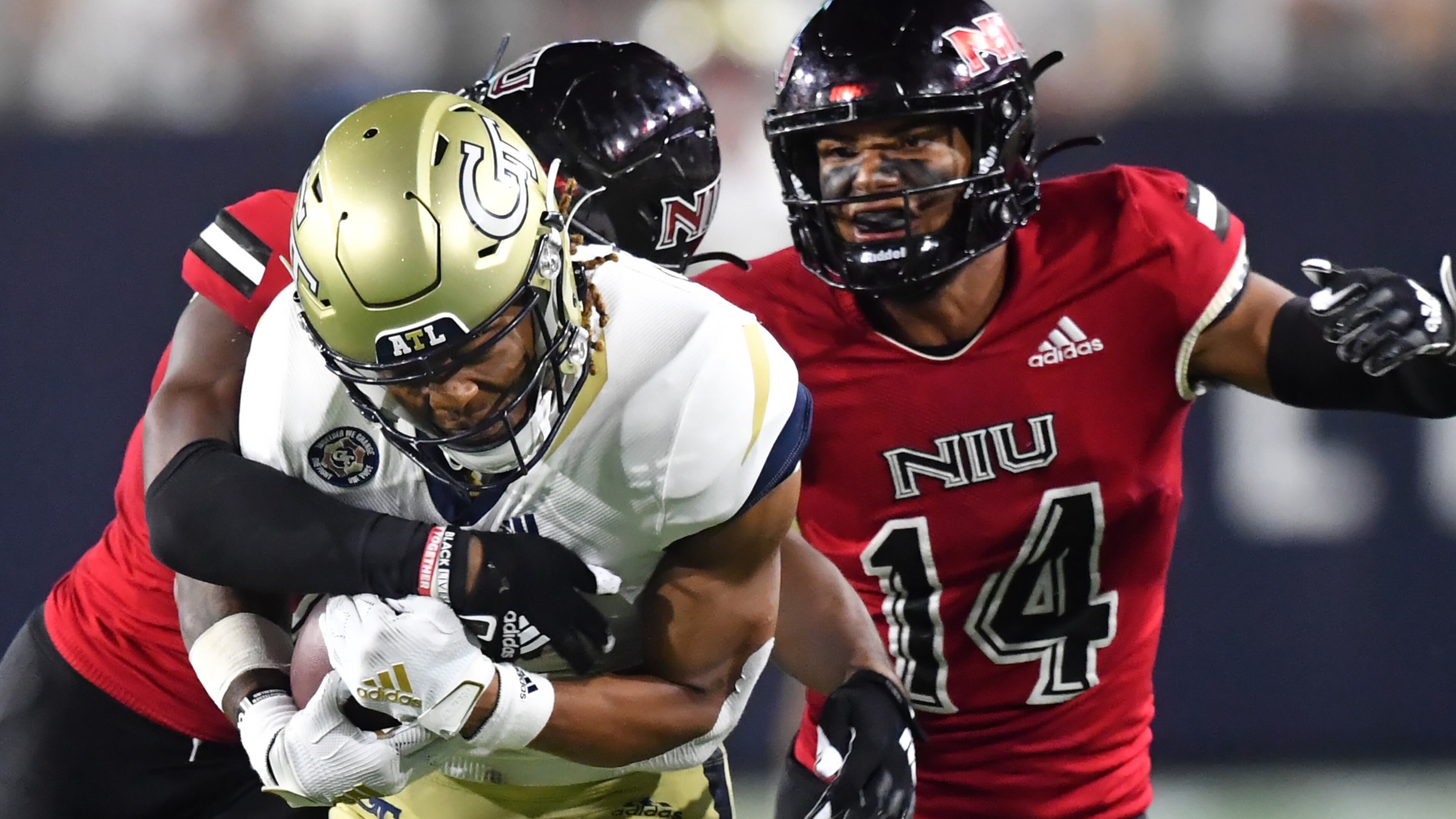 Georgia Tech wide receiver Malachi Carter (7) is tackled by Northern Illinois safety CJ Brown (6) after he made a catch during the second half Saturday, Sept. 4, 2021, at Bobby Dodd Stadium in Atlanta. Northern Illinois won 22-21. (Hyosub Shin / Hyosub.Shin@ajc.com)