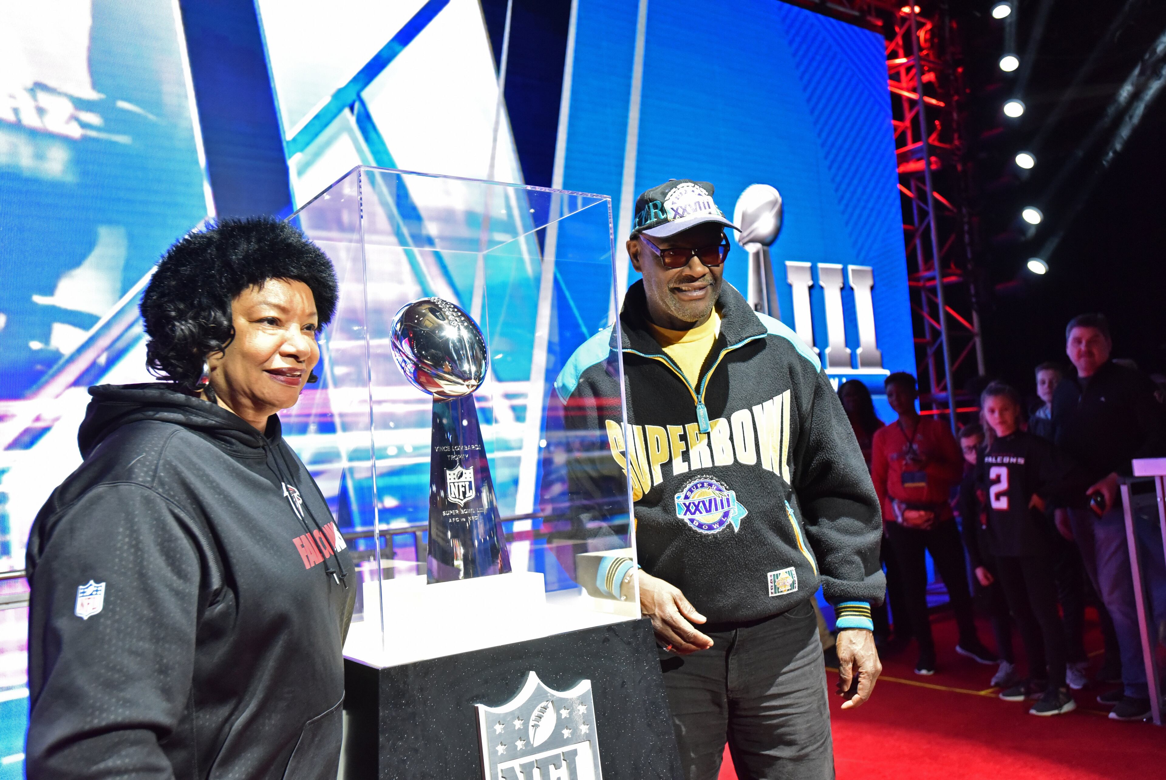 January 30, 2019 Atlanta - Janice Foston (left) and Albert Knight pose with the Vince Lombardi Trophy during Super Bowl Experience inside Georgia World Congress Center on Wednesday, January 30, 2019. HYOSUB SHIN / HSHIN@AJC.COM