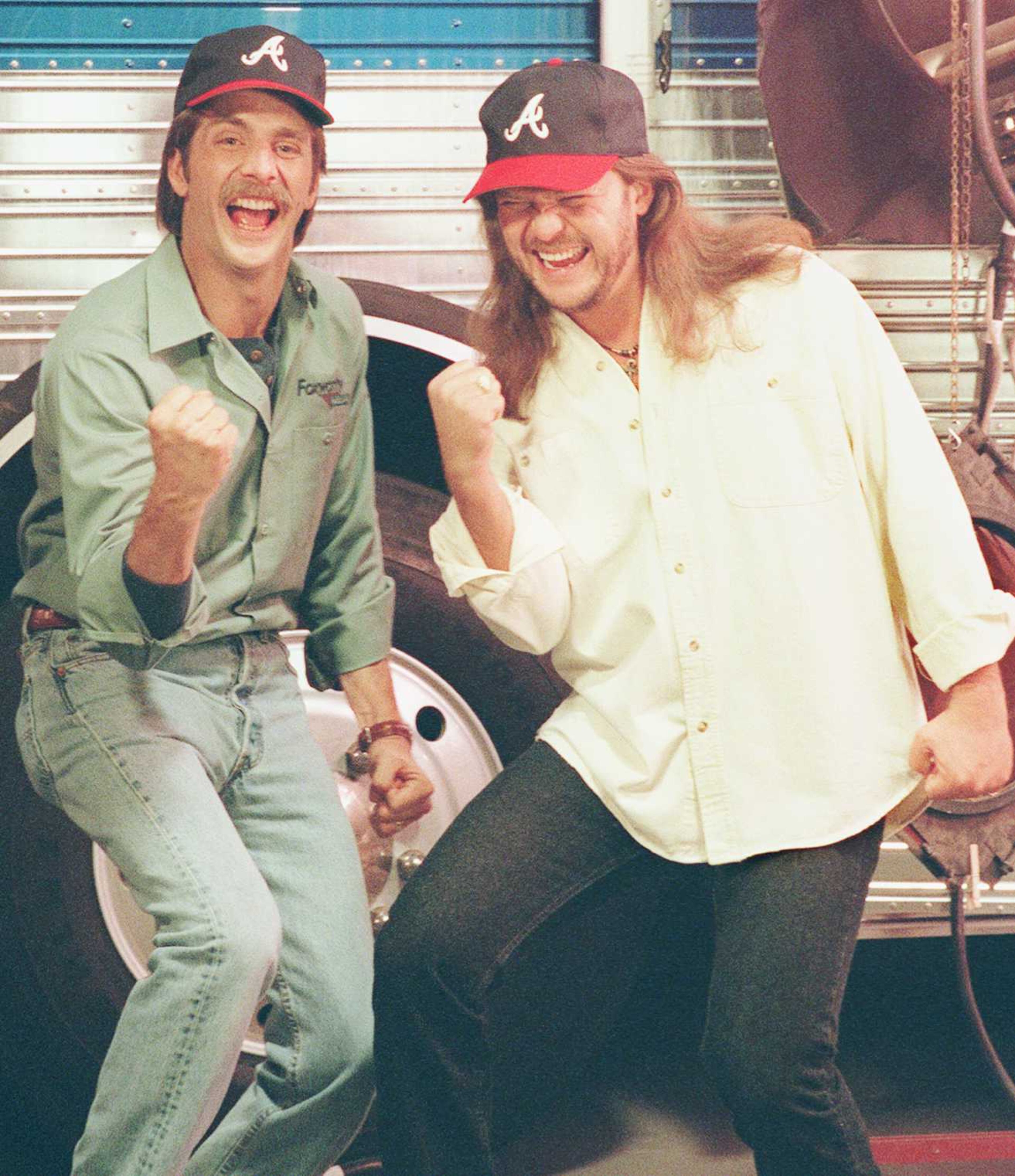 Jeff Foxworthy, star of the ABC comedy series 'The Jeff Foxworthy Show,' left, and country music star Travis Tritt show their support for their favorite World Series team, the Atlanta Braves, during taping of the Foxworthy show in Los Angeles, Thursday, Oct. 26, 1995.