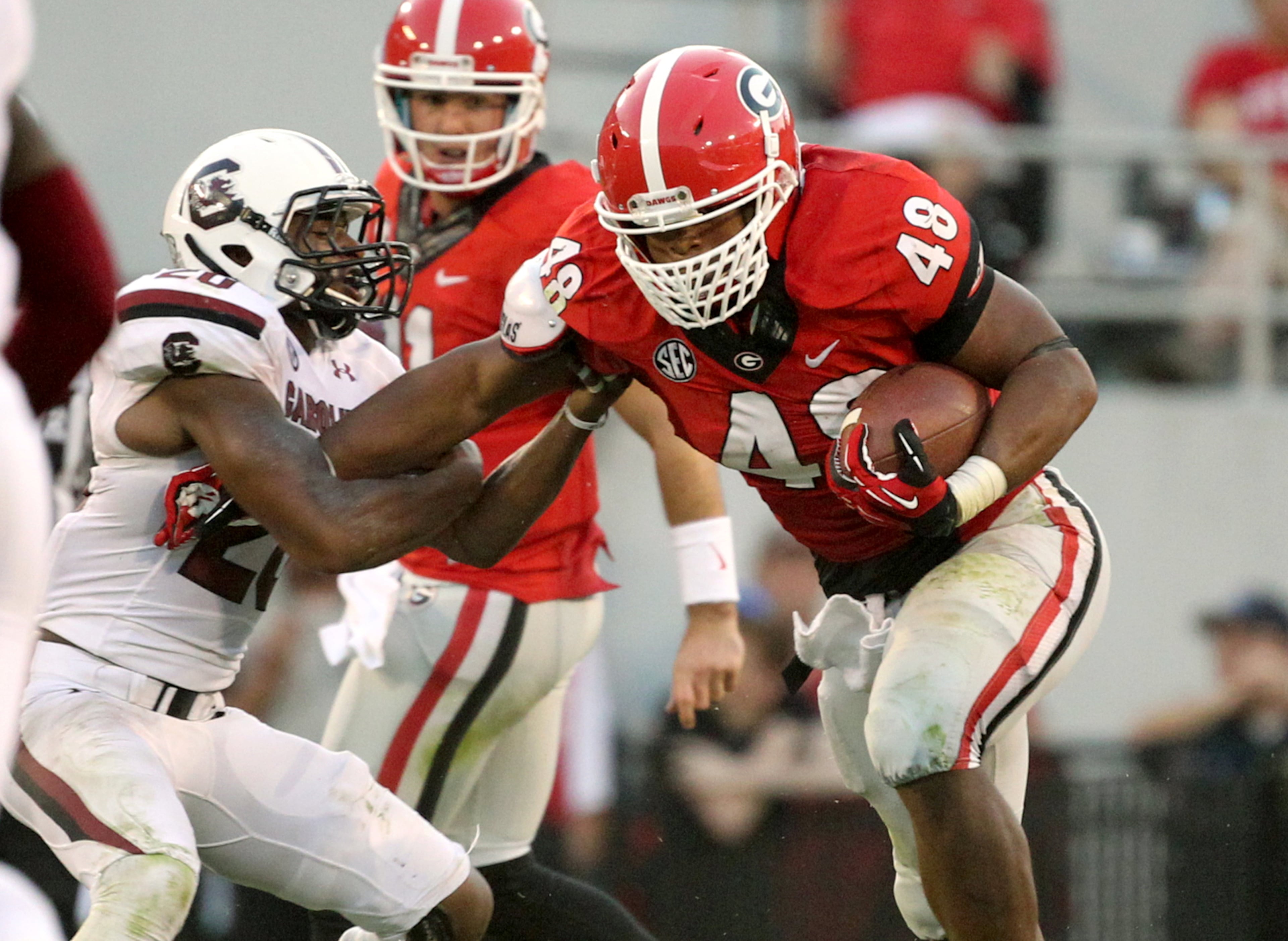 Georgia fullback Quayvon Hicks (48) runs for short yardage in the fourth quarter during Georgia's win over South Carolina Saturday afternoon in Athens, Ga., September 7, 2013. JASON GETZ / JGETZ@AJC.COM