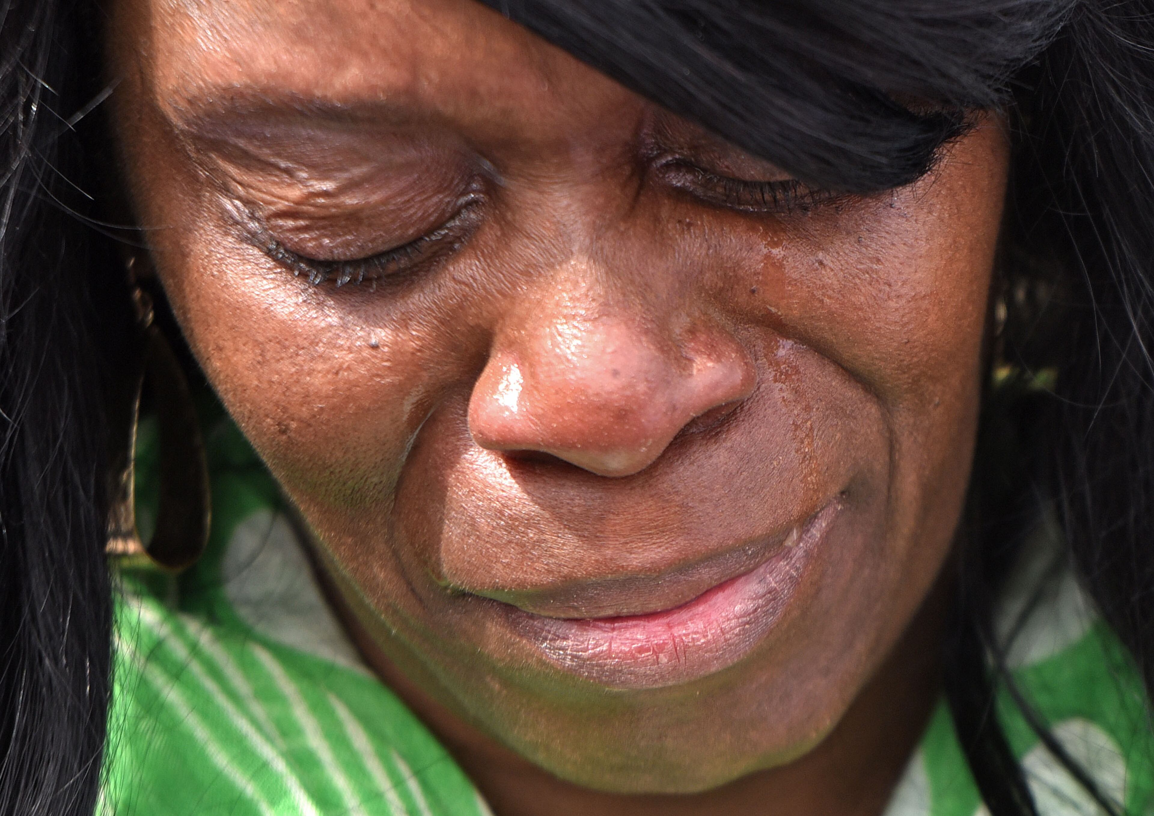 March 8, 2015 Selma, Alabama - Verna Pearson, of Tampa, Florida, can't hide her emotion as she and her friends take a symbolic walk on Sunday, March 8, 2015. Thousands of people took part in a bridge crossing reenactment in Selma on Sunday to commemorate the 50th anniversary of Bloody Sunday. HYOSUB SHIN / HSHIN@AJC.COM