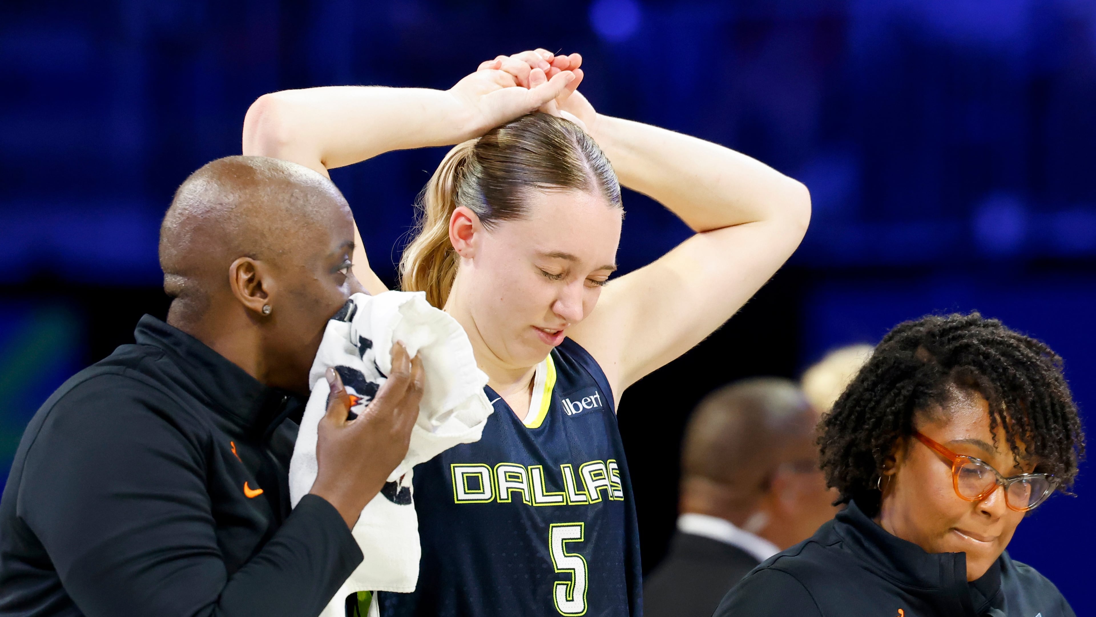 Dallas Wings guard Paige Bueckers (5) holds her head after a collision with Los Angeles Sparks forward Nneka Ogwumike during the second half of a WNBA basketball game, Sunday, July 19, 2026, in Arlington, Texas. (Elías Valverde II/The Dallas Morning News via AP)