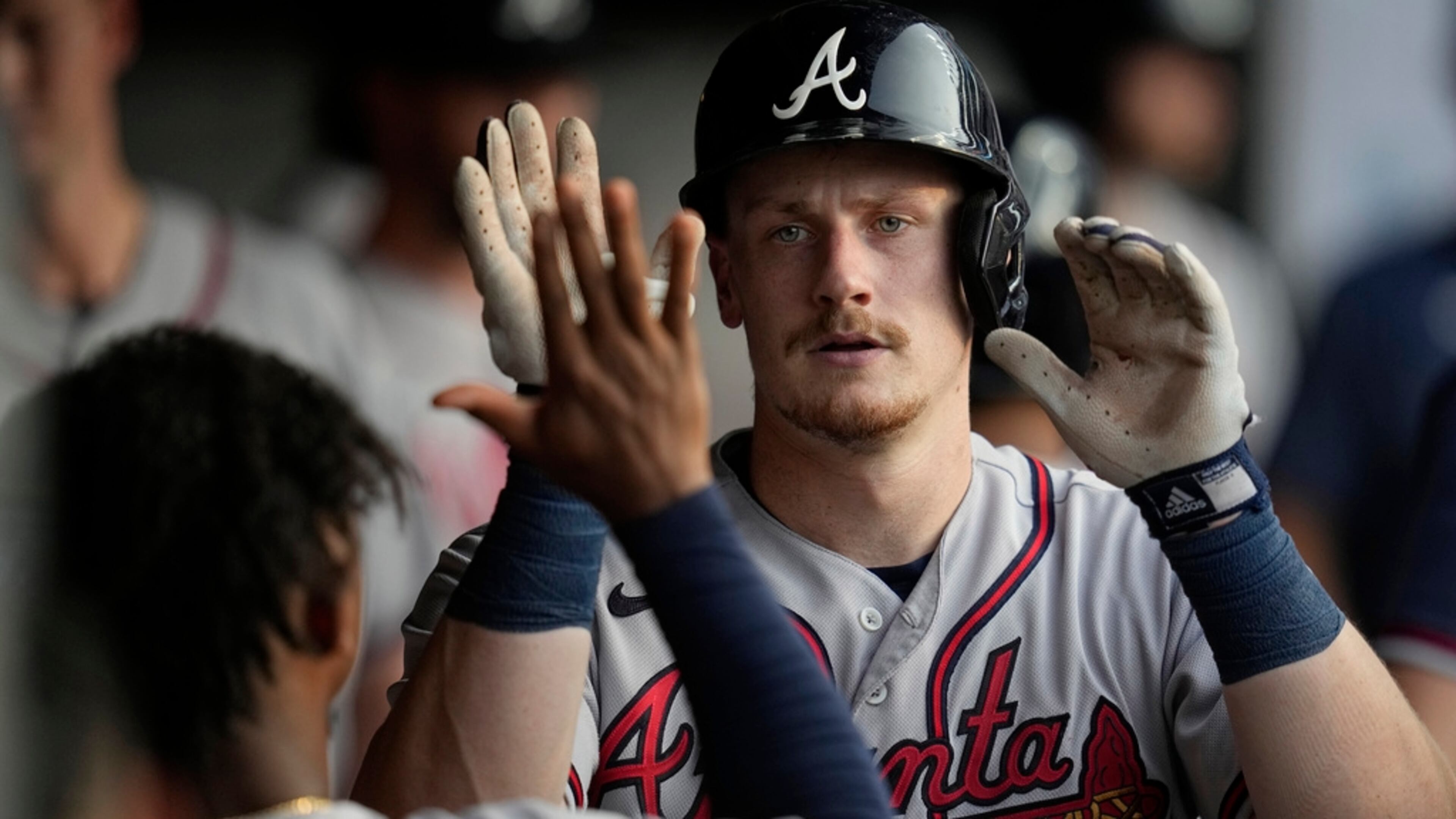 Atlanta Braves' Sean Murphy gets high-fives in the dugout after hitting a home run against the Cleveland Guardians during the third inning of a baseball game Wednesday, July 5, 2023, in Cleveland. (AP Photo/Sue Ogrocki)