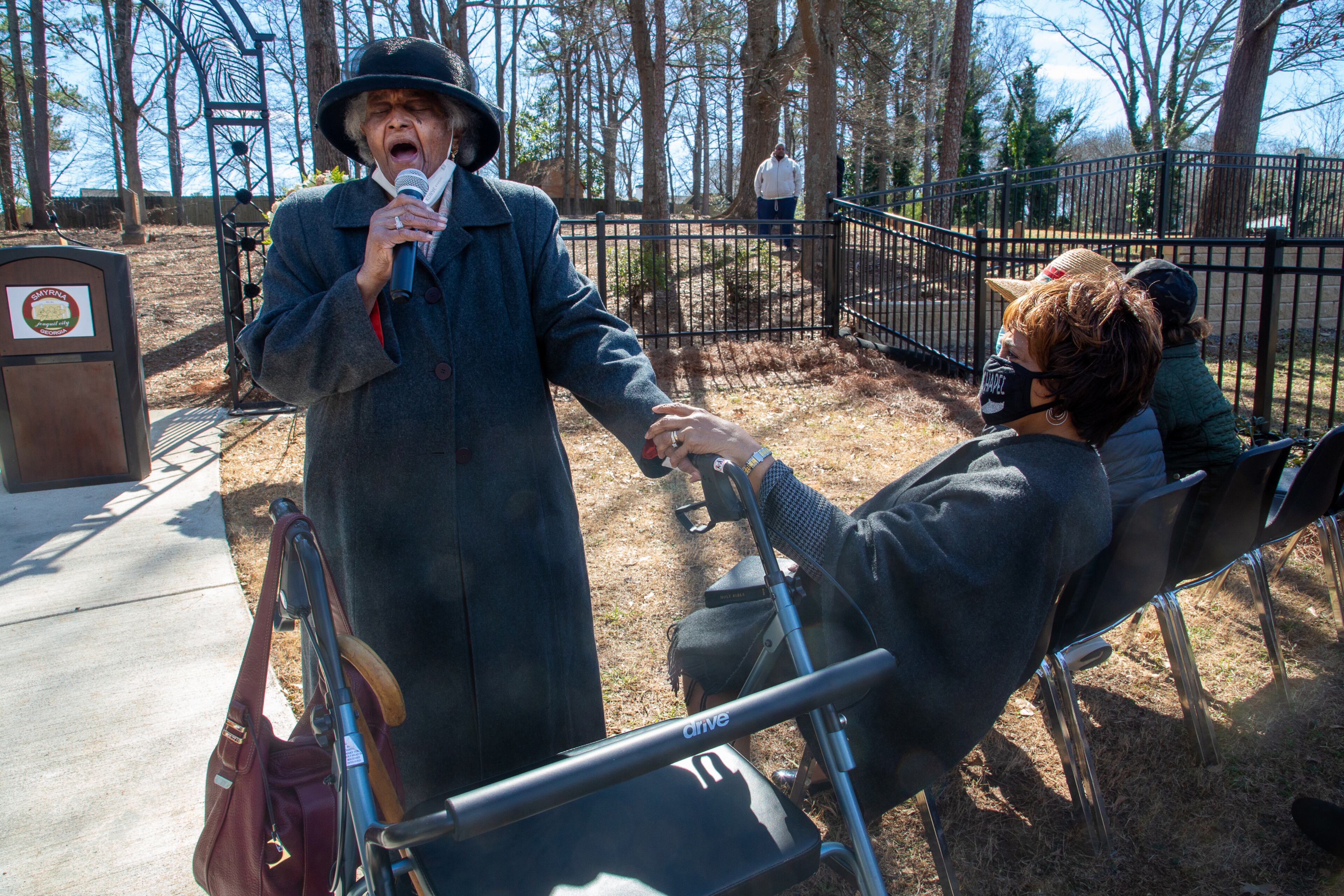 Annie Maedukes sings "Amazing Grace" during the rededication ceremony of the Mount Zion Cemetery in Smyrna on Sunday, February 20, 2022. (Photo: Steve Schaefer for The Atlanta Journal-Constitution)
