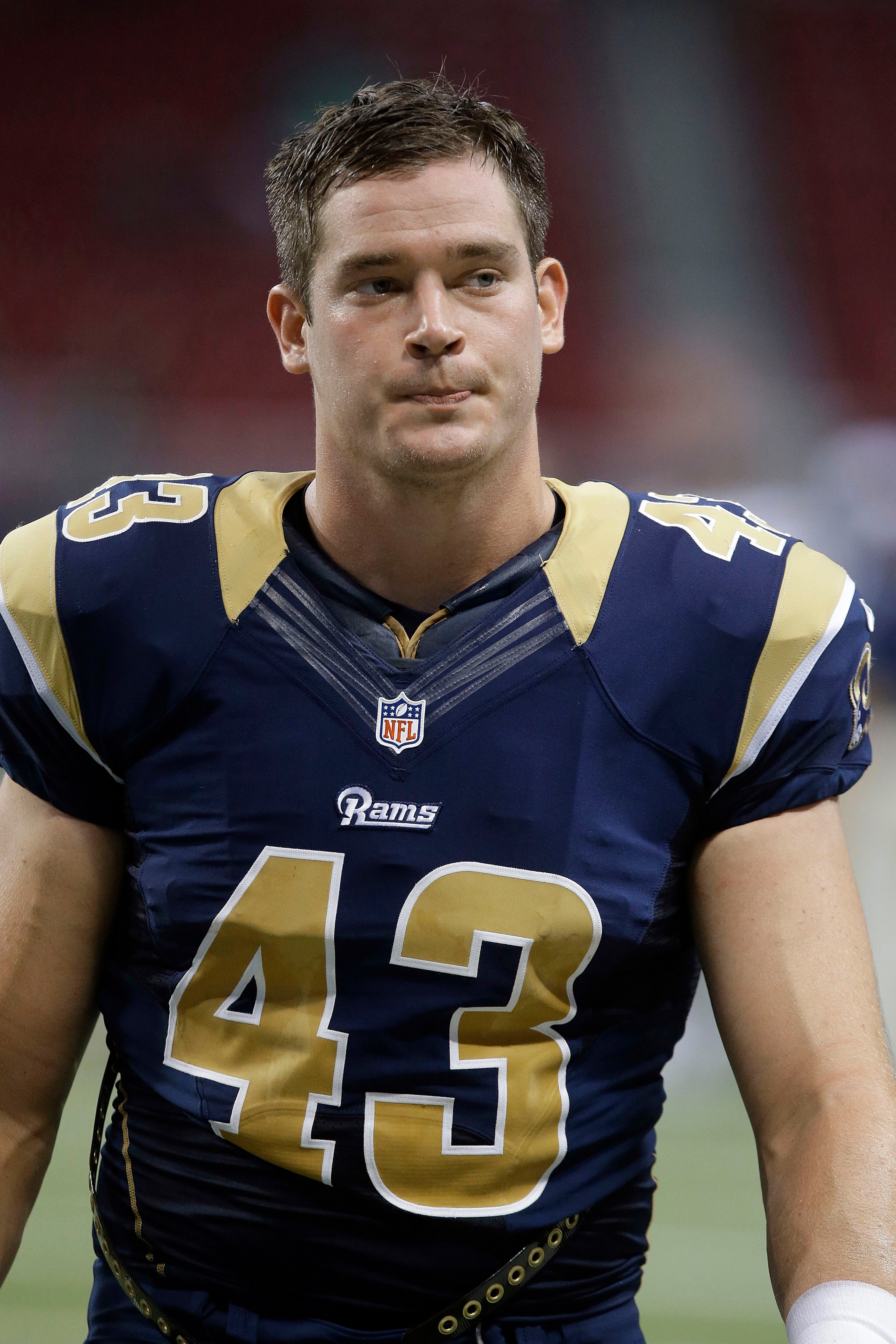 File-This Aug. 17, 2013, file photo shows St. Louis Rams tight end Philip Lutzenkirchen (43) walking off the field during the fourth quarter of an NFL football game in St. Louis. Georgia state police say a former Auburn University tight end has died in a one-car crash in western Georgia. Authorities say 23-year-old Lutzenkirchen was ejected from a 2006 Chevrolet Tahoe when it overturned several times near LaGrange, Georgia early Sunday, June 29, 2014. (AP Photo/Seth Perlman, File)