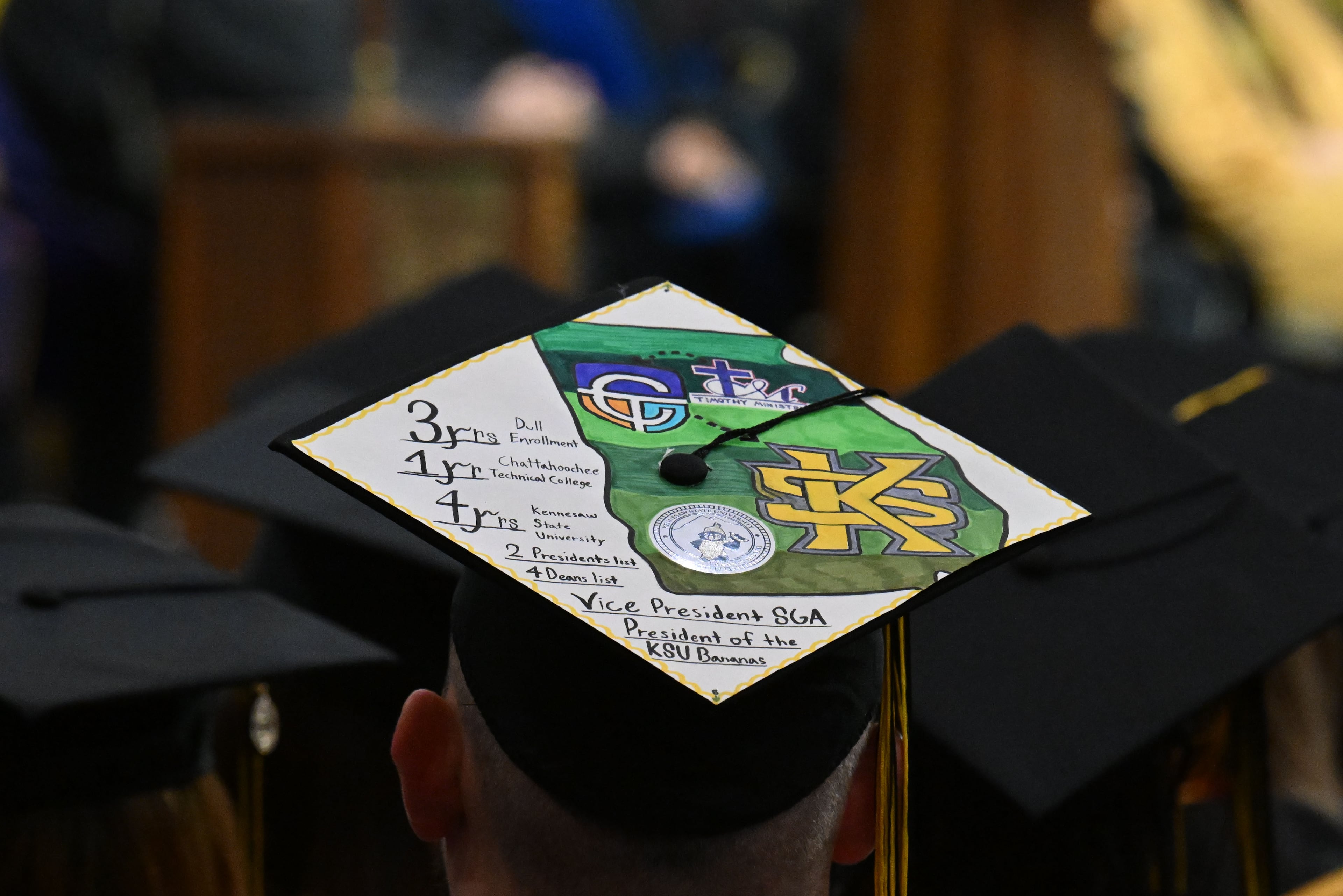 Many graduates decorated their mortarboards commencement at KSU Convocation Center on Wednesday. (Hyosub Shin/AJC)