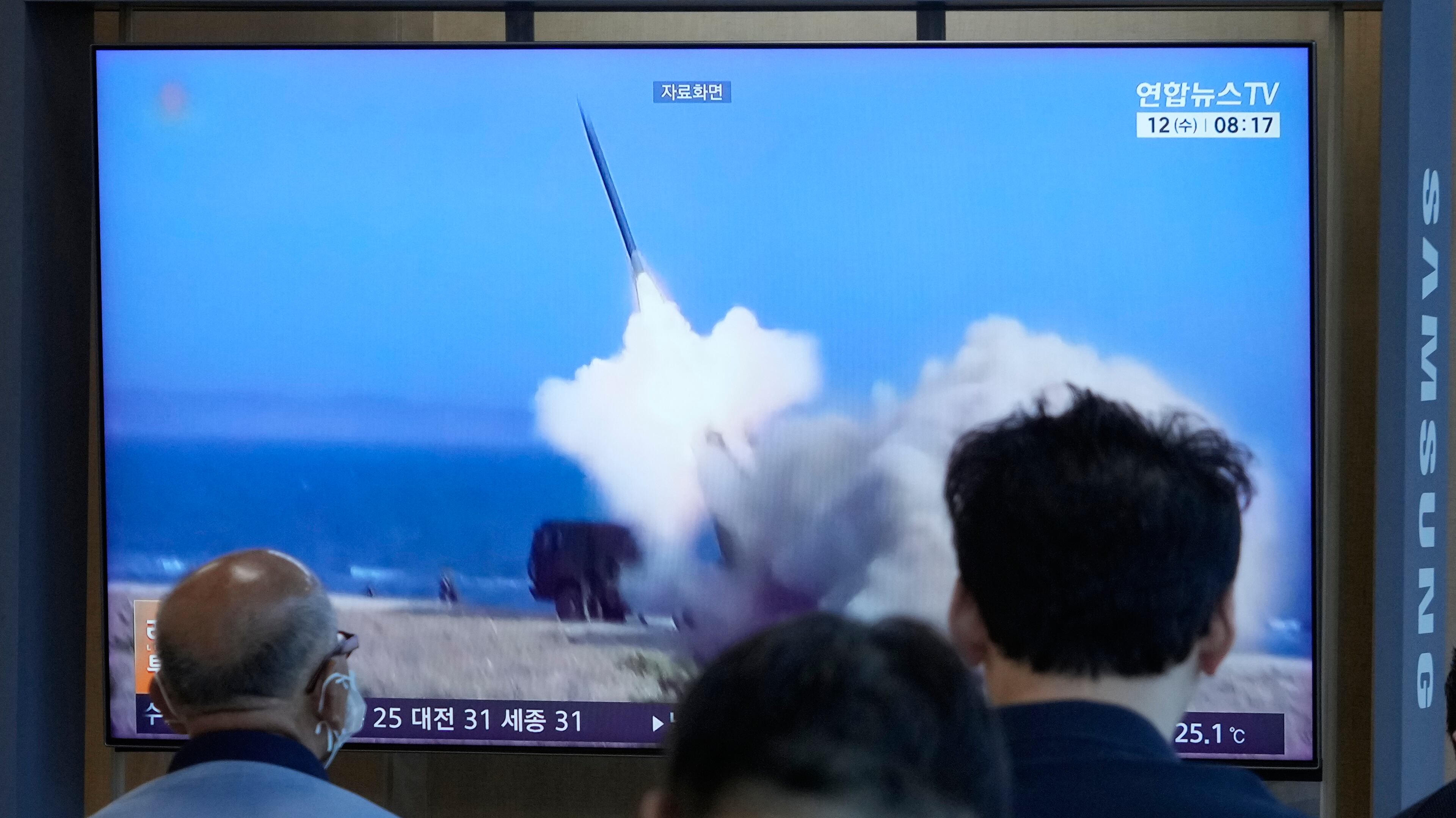 A TV screen shows a file image of North Korea's missile launch during a news program at Seoul Railway Station in Seoul, South Korea, Wednesday, Aug. 12, 2026. (AP Photo/Ahn Young-joon)
