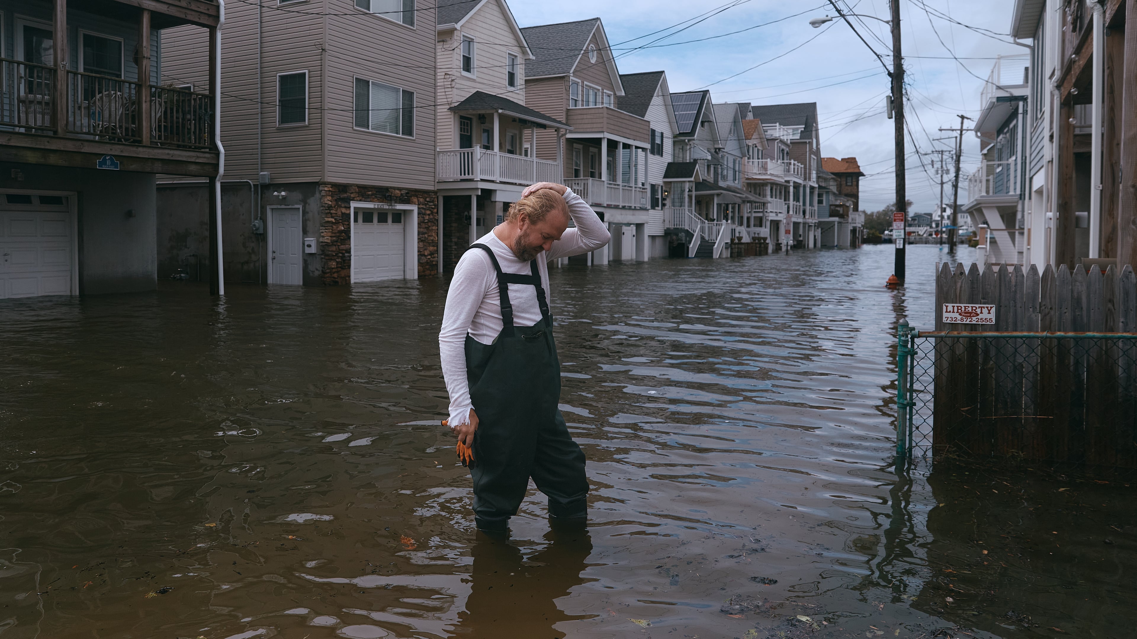 Chris Ransom reacts as he stands on a flooded street during a nor'easter storm on Sunday, Sept. 27, 2026, in Sea Bright, N.J. (AP Photo/Andres Kudacki)