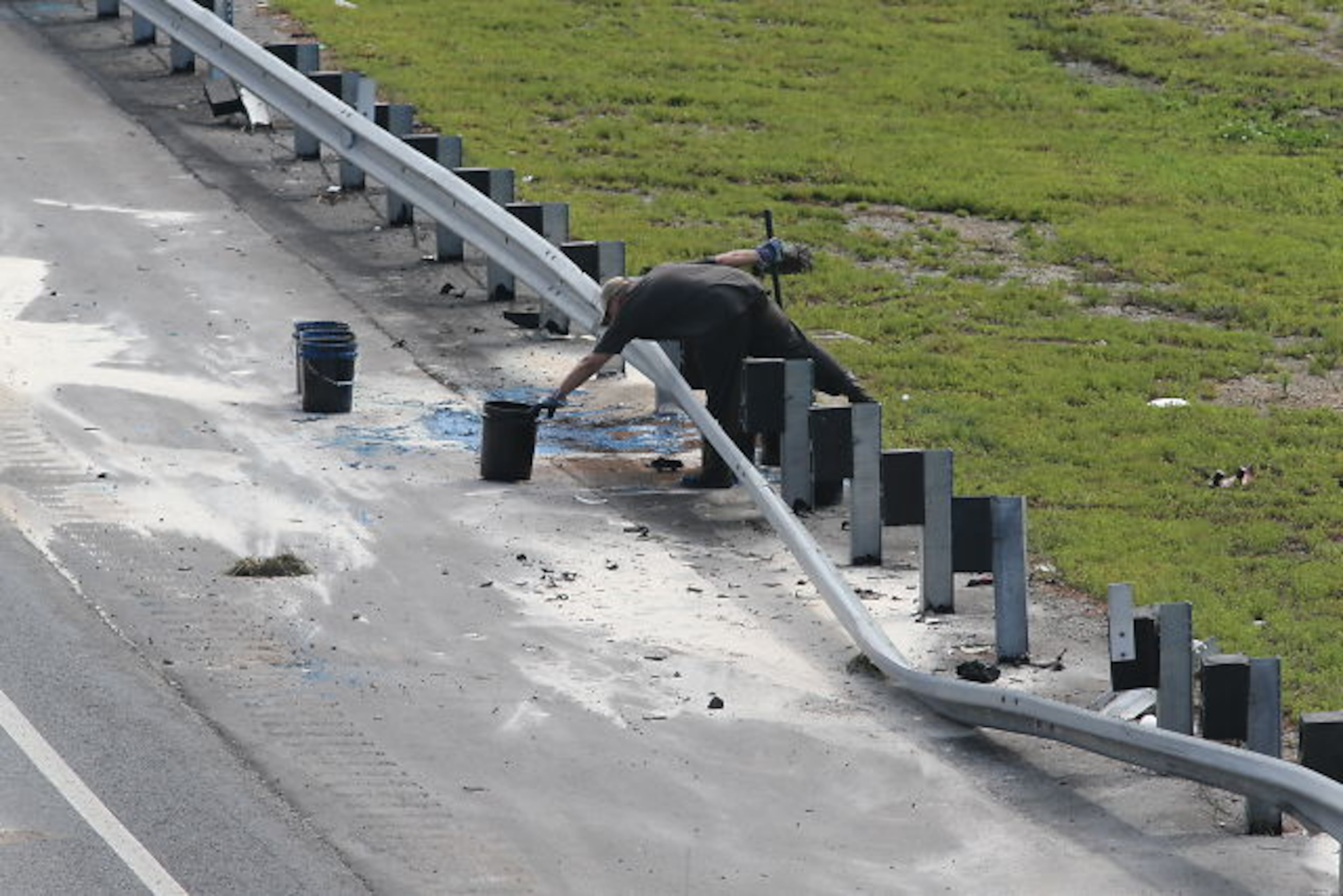 A truck was pulling a trailer loaded with 55-gallon drums of paint when two of the drums fell off near Wesley Chapel Road.