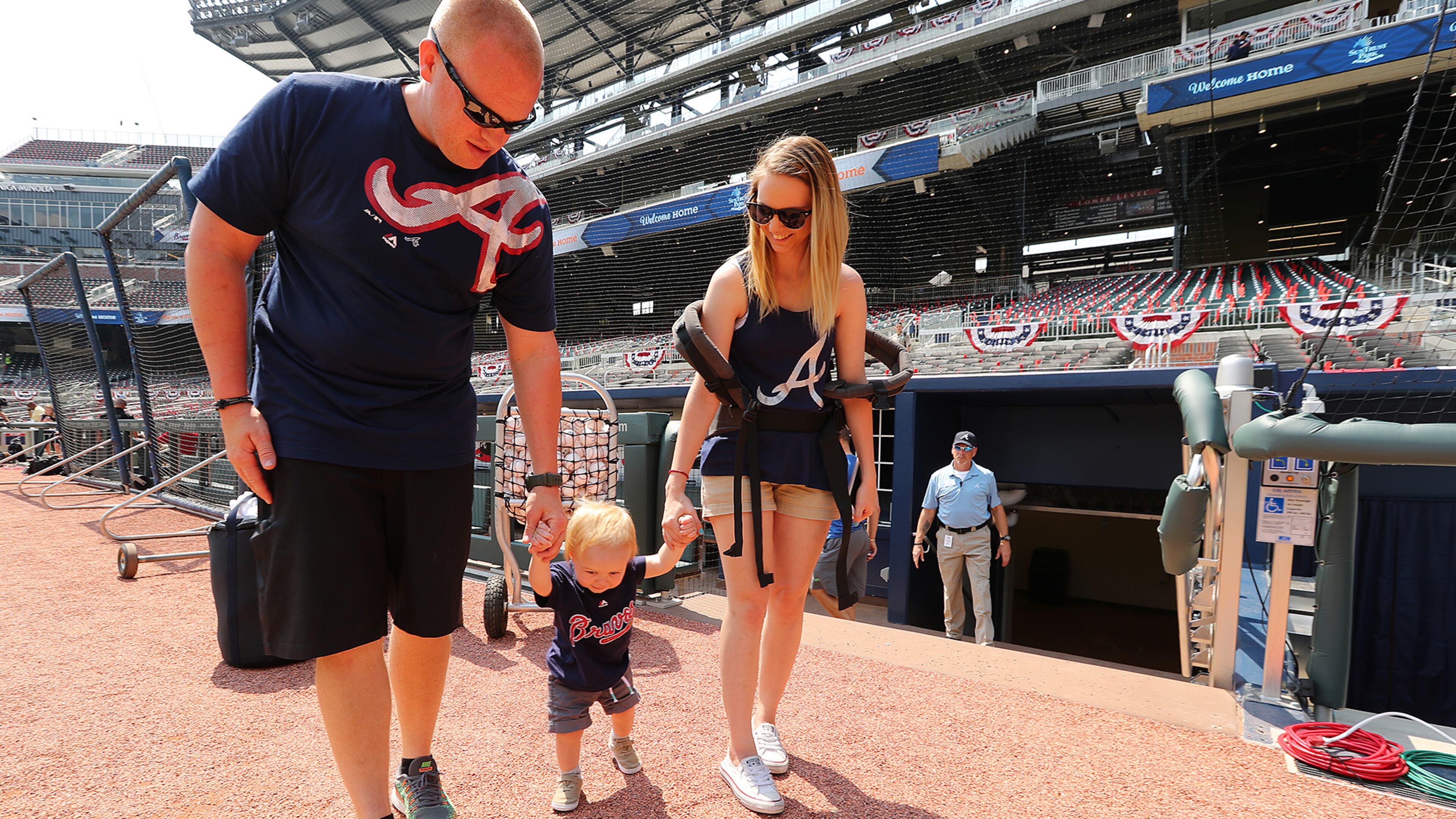 April 14, 2017, Atlanta: Greg and Kayleigh Lock give their 1-year-old son Landon a tour of the dugout and the field before the Braves home opener in their new stadium at SunTrust Park on Friday, April 14, 2017, in Atlanta. Curtis Compton/ccompton@ajc.com