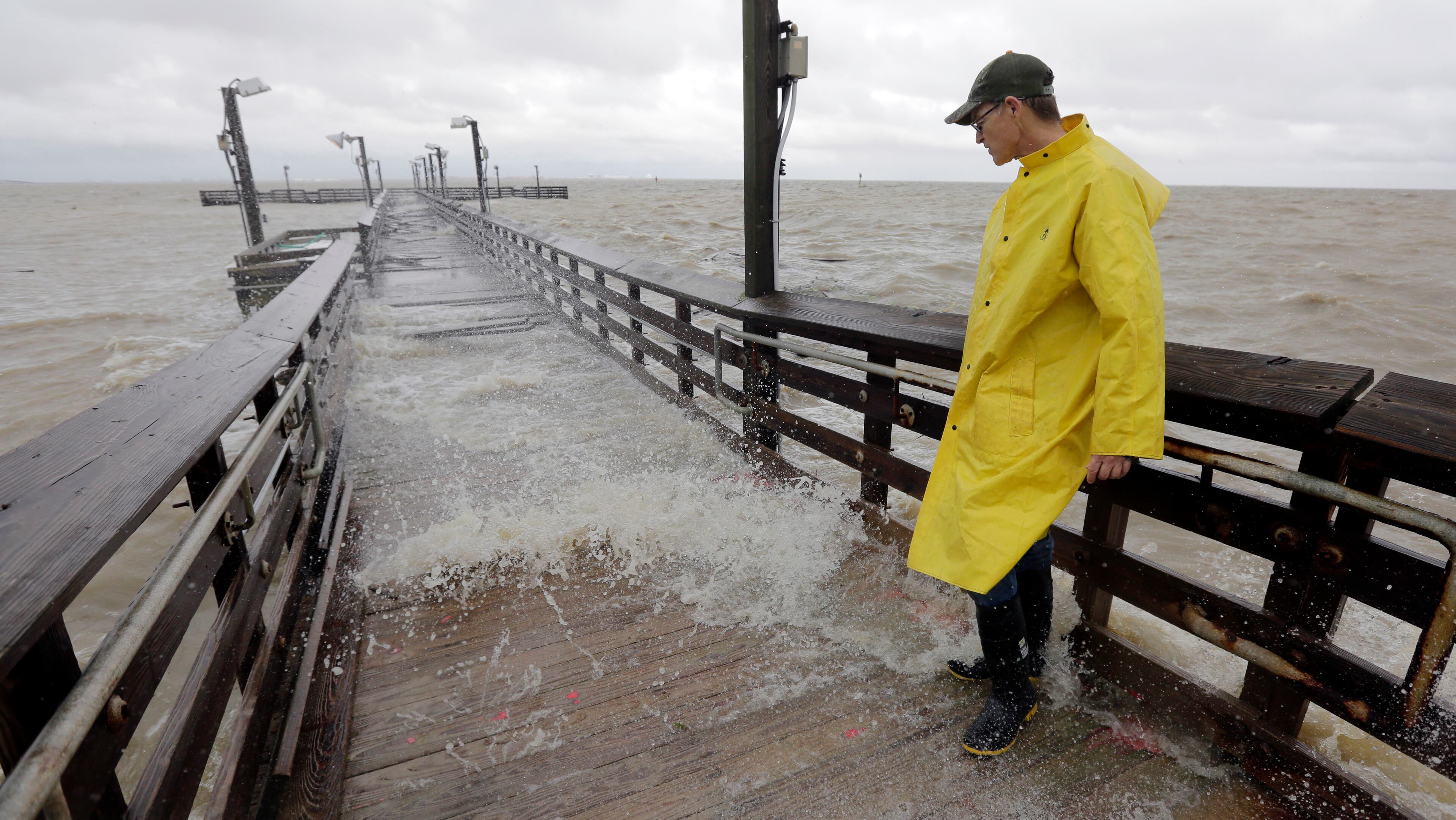Port Lavaca Mayor Jack Whitlow surveys damage to a park pier as Tropical Storm Bill passes over, Tuesday, June 16, 2015, in Port Lavaca, Texas. The storm came ashore shortly before noon along Matagorda Island with maximum sustained winds of 60 mph, according to the National Hurricane Center in Miami. (AP Photo/Eric Gay)