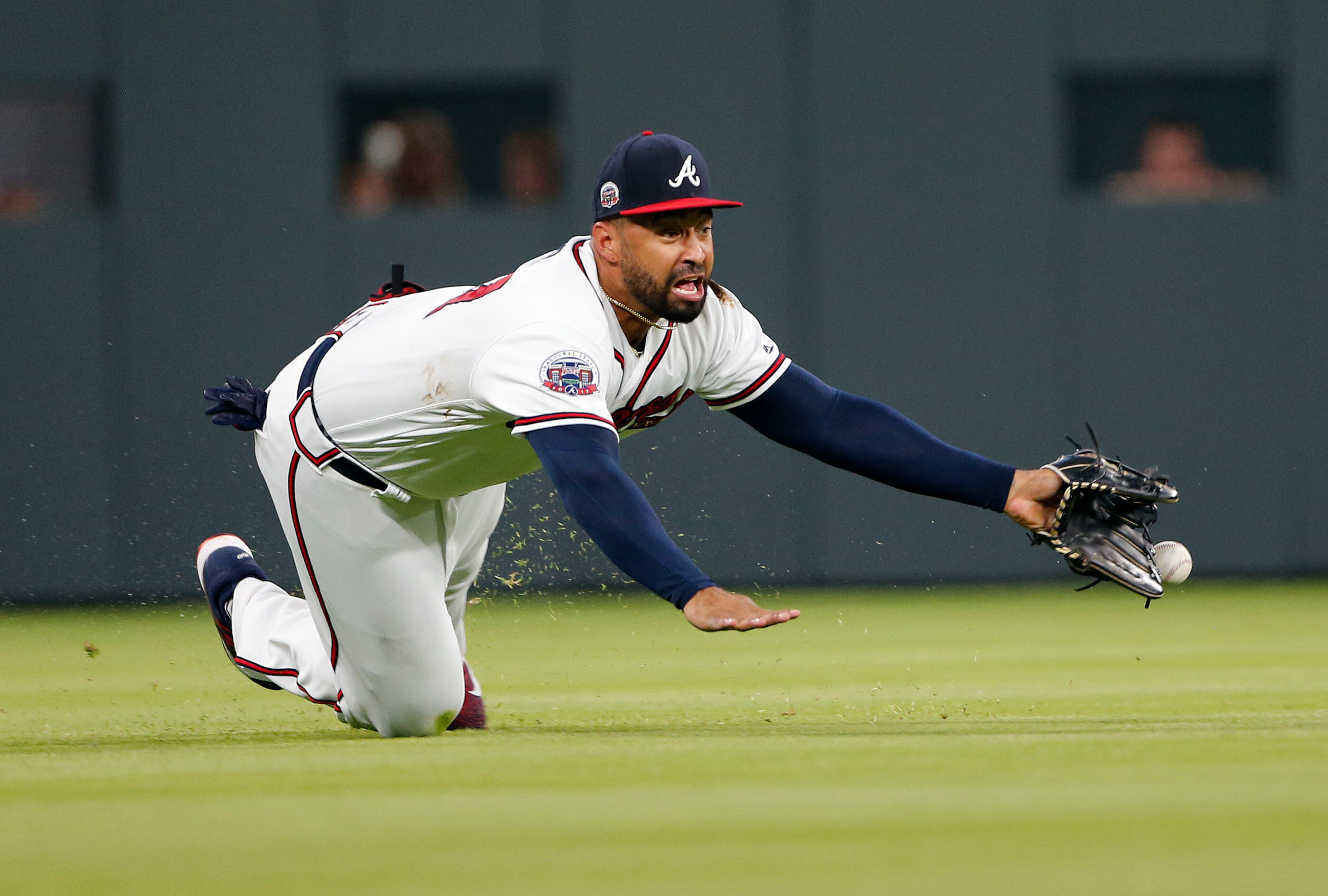 Atlanta Braves left fielder Matt Kemp (27) makes a diving attempt for a ball hit for a single by Toronto Blue Jays' Luke Maile in the fourth inning of a baseball game Wednesday, May 17, 2017, in Atlanta. (AP Photo/John Bazemore)