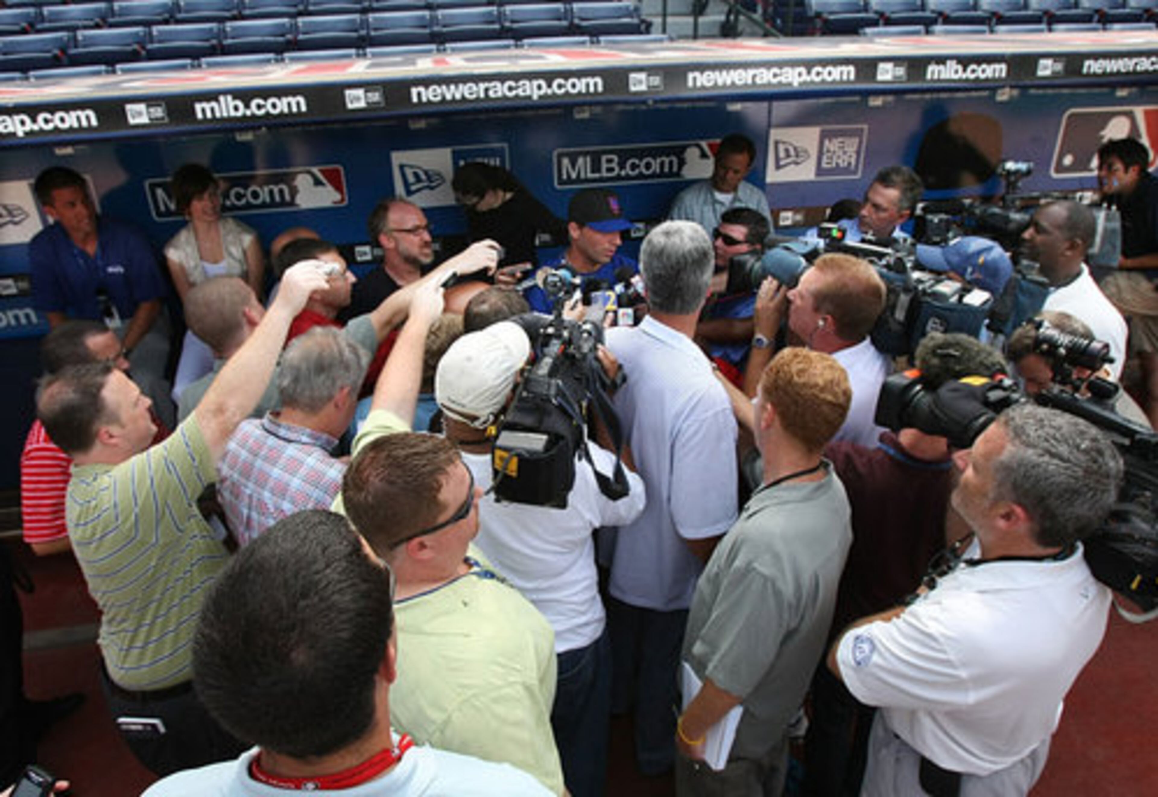 Camera crews surround Francoeur on his return to Atlanta.