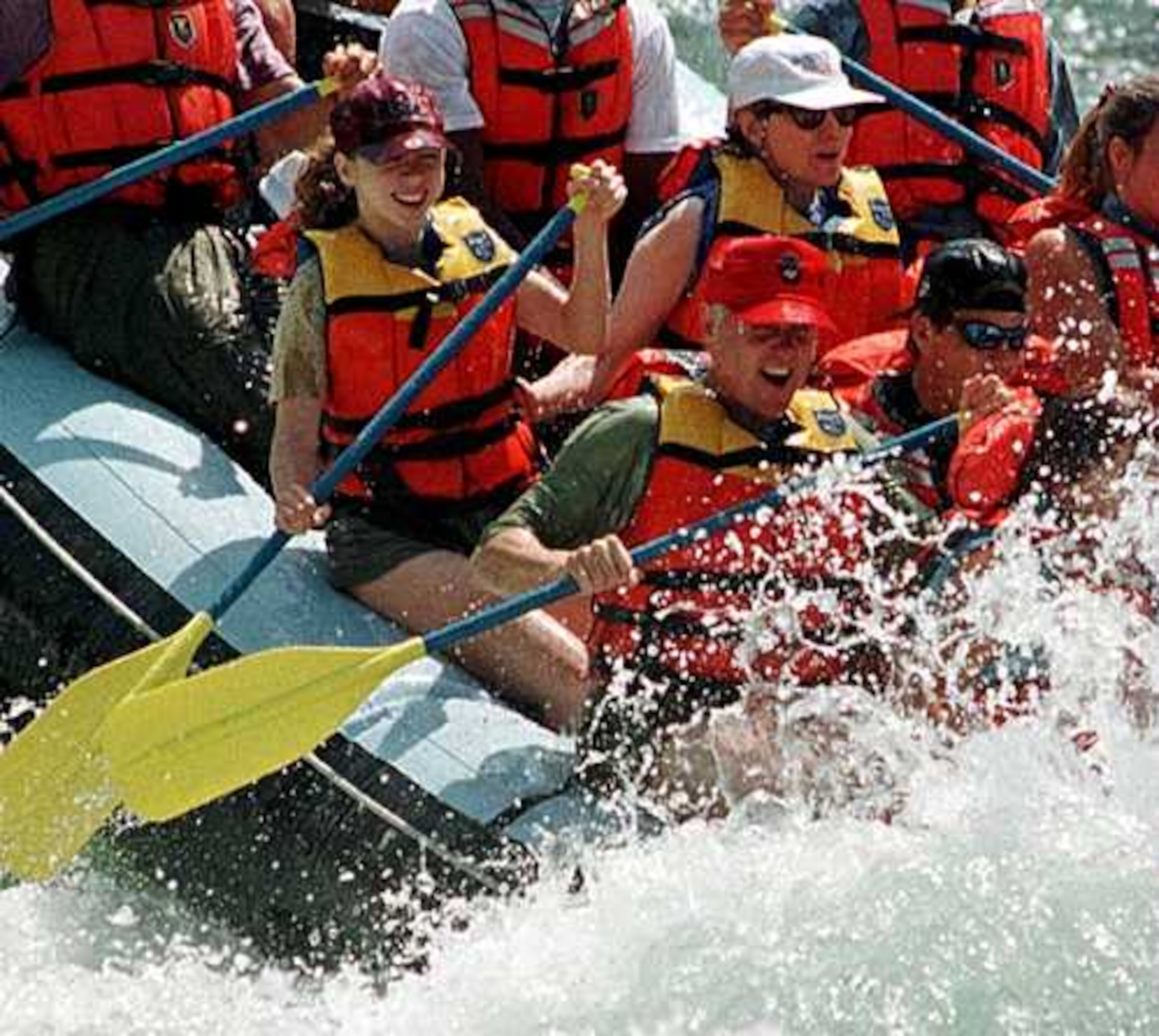 President Clinton, his daughter and wife get splashed by water as they run the Big Kahuna Rapids during a raft trip on the Snake River near Alpine Junction, Wyo., in 1996.