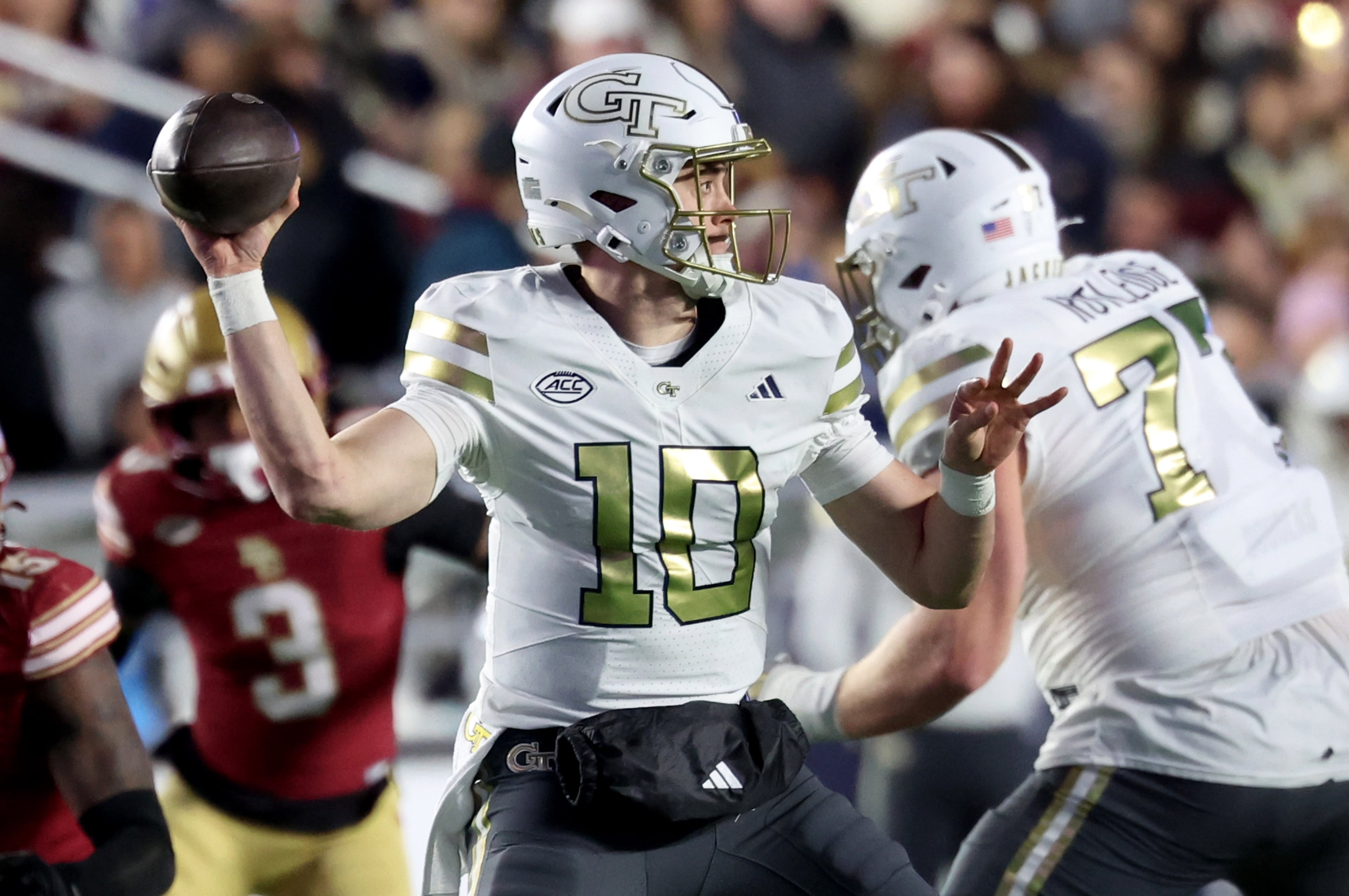 Georgia Tech quarterback Haynes King (10) looks for a receiver during the first half of an NCAA college football game against Boston College, Saturday, Nov. 15, 2025 in Boston. (AP Photo/Mark Stockwell)