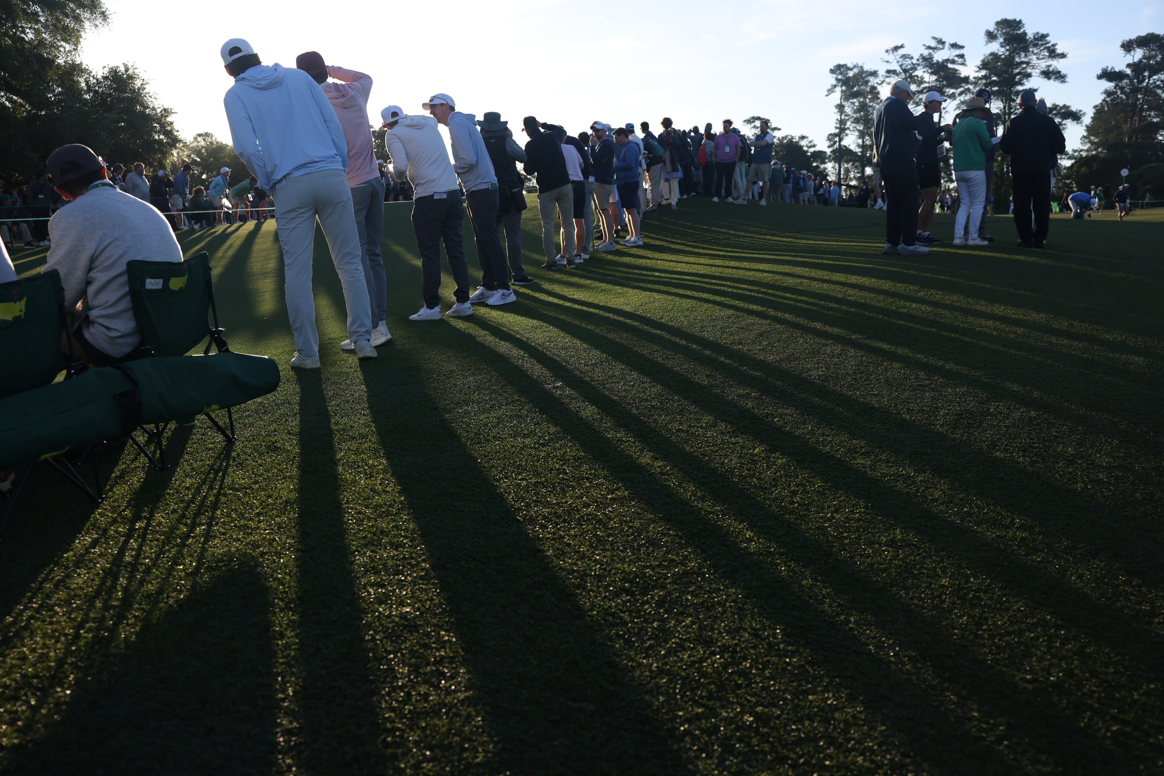 Patrons watch golfers on first hole during first round of the Masters Tournament, at Augusta National Golf Club, Thursday, April 9, 2026, in Augusta, Ga. (Jason Getz/AJC)