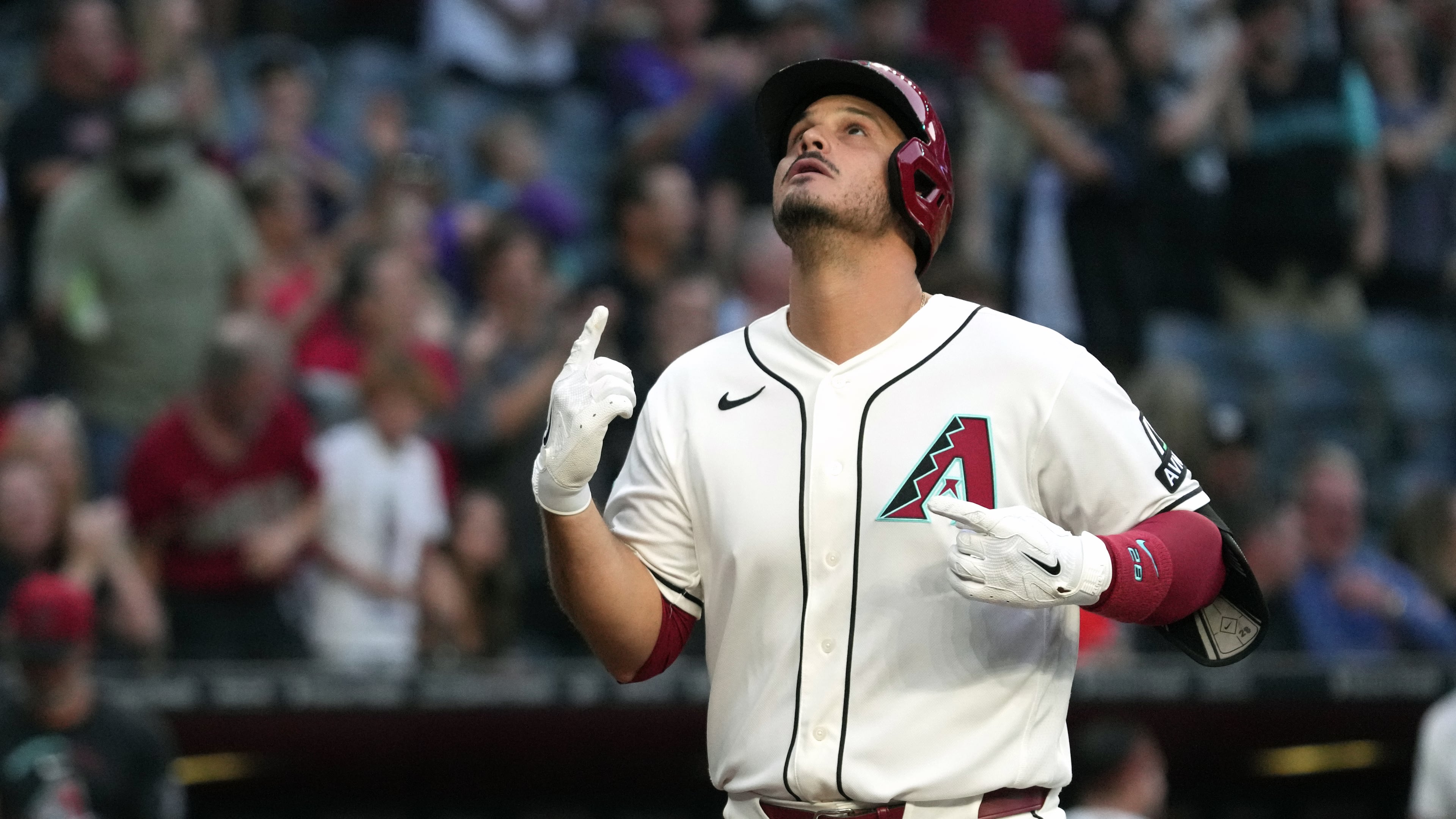 Arizona Diamondbacks' Nolan Arenado celebrates after hitting a grand slam against the San Francisco Giants in the first inning of a baseball game, Monday, May 18, 2026, in Phoenix. (AP Photo/Rick Scuteri)