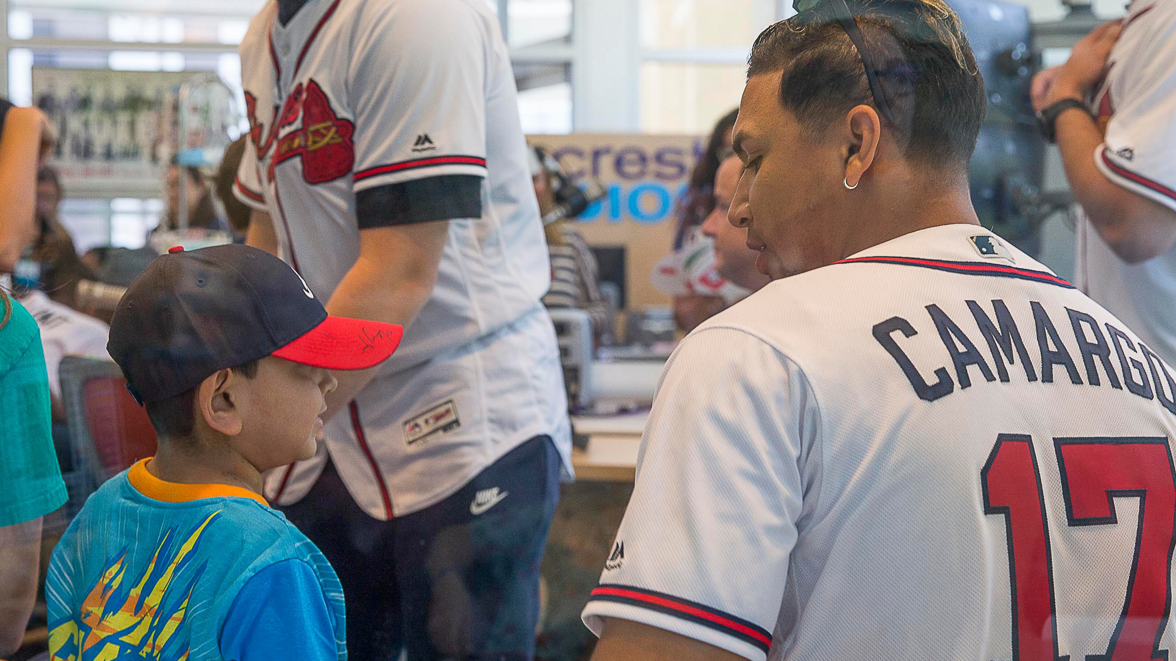 Braves third baseman Johan Camargo (right) speaks with a patient during the team's visit Tuesday, May 28, 2019, to the Children's Healthcare of Atlanta at Egleston Hospital. Players met with kids and signed autographs and performed arts and crafts projects during the visit.