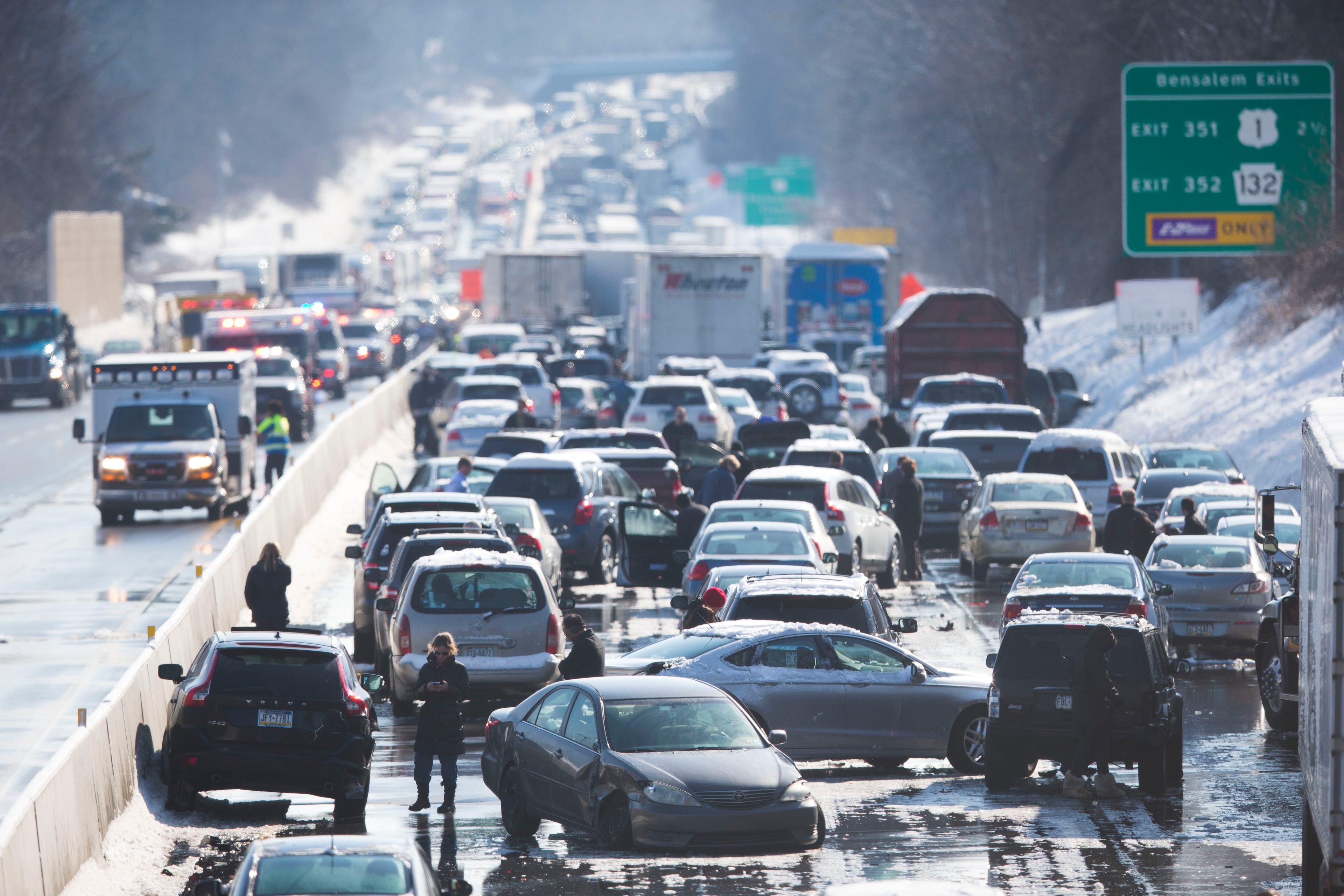 Vehicles are piled up in an accident Friday, Feb. 14, 2014, in Bensalem, Pa. Traffic accidents involving multiple tractor trailers and dozens of cars have completely blocked one side of the Pennsylvania Turnpike outside Philadelphia and caused some injuries. (AP Photo/Matt Rourke)