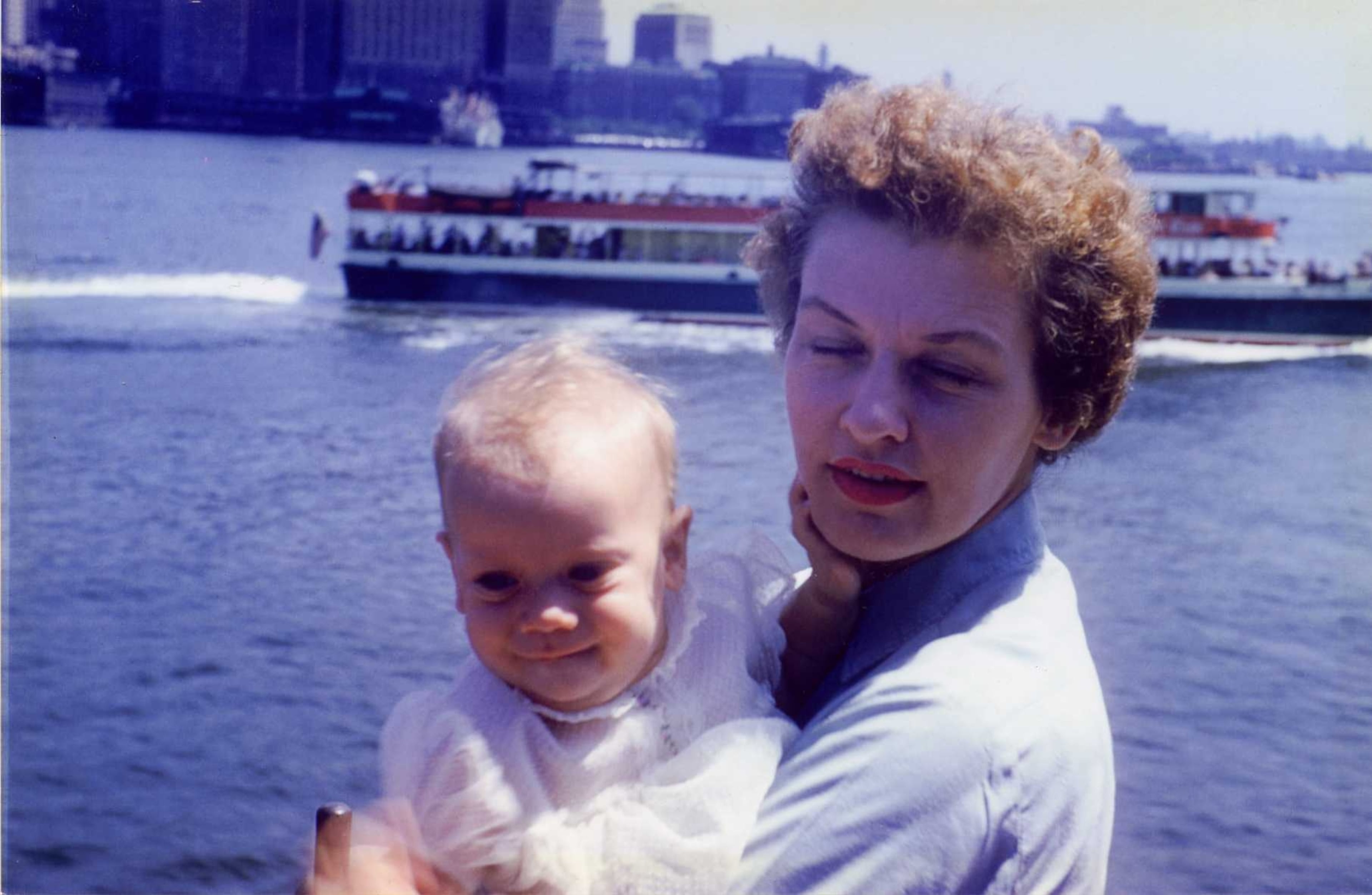 Sally Vejnoska keeps a tight hold on her infant daughter, Jill, during a ferry ride across New York Harbor. When Jill was a child, she imagined her stylish mother was a cross between Lucille Ball and Lauren Bacall.
