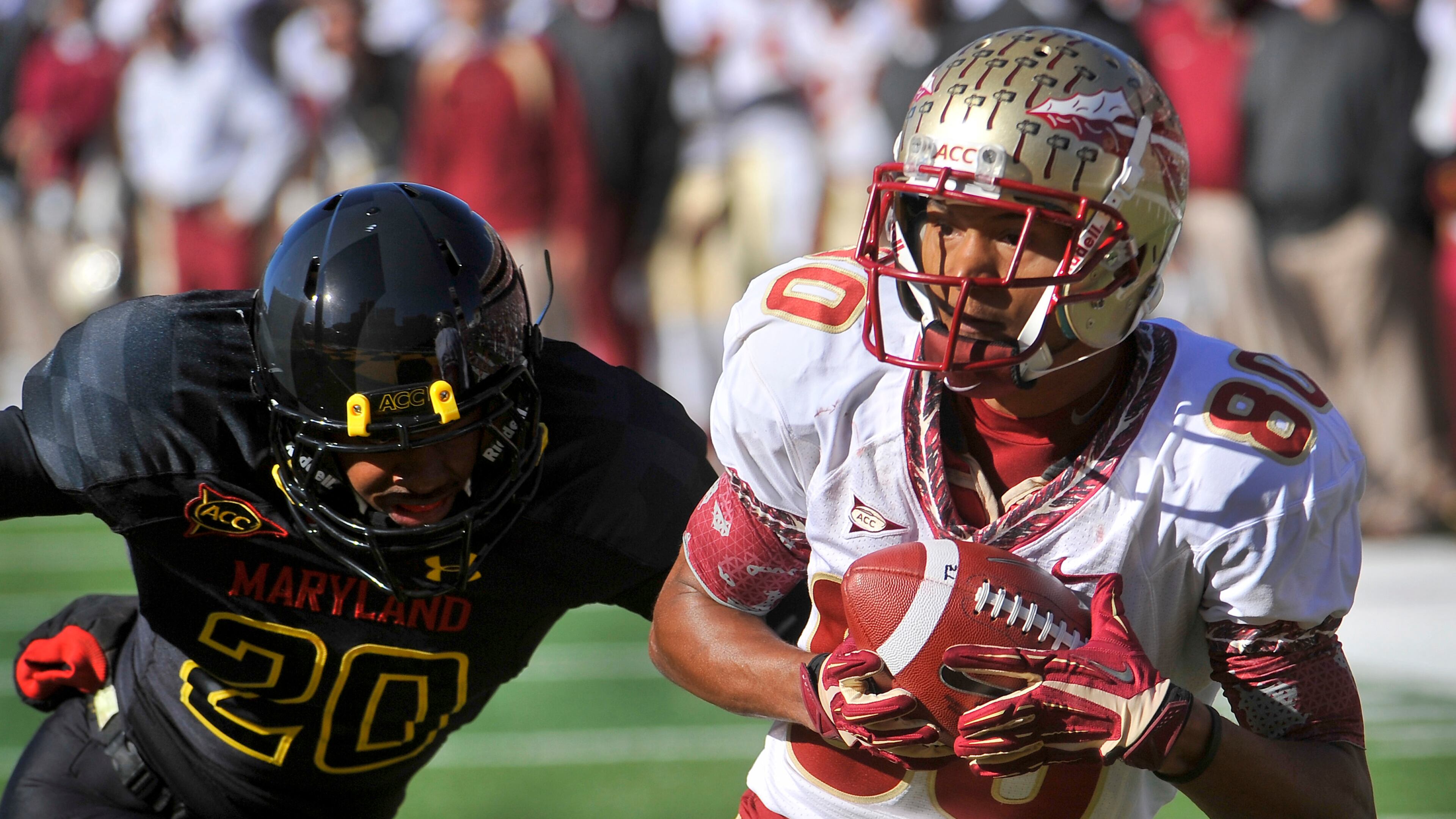 Florida State's Rashad Greene catches a pass in front of Maryland's Anthony Nixon and runs 30 yards for a touchdown at Byrd Stadium in College Park, Maryland, on Saturday, November 17, 2012. The Florida State Seminoles defeated the Maryland Terrapins, 41-14. (Mark Gail/MCT)