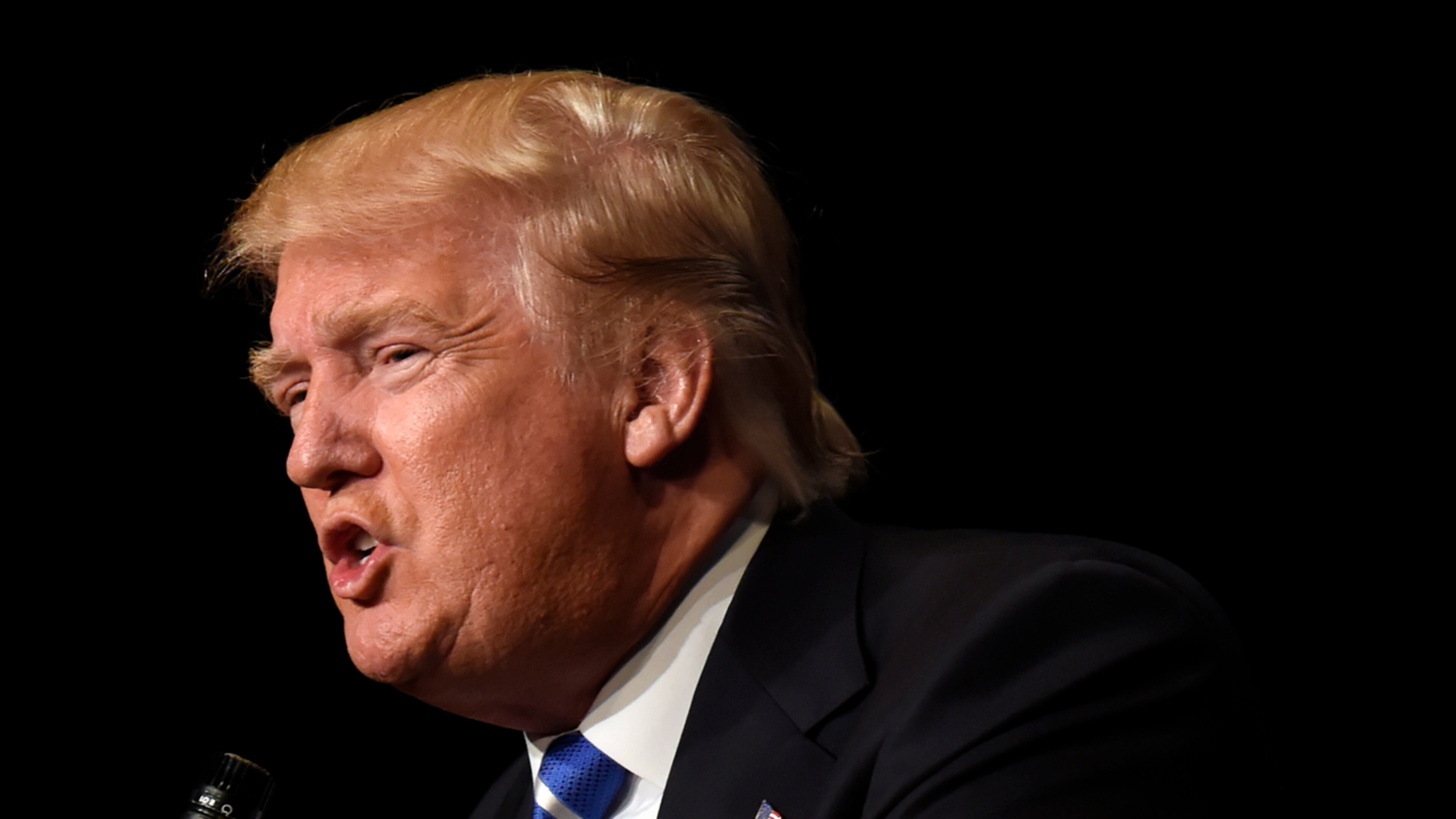 Republican presidential candidate Donald Trump still leads polls in the states that open the 2016 Republican presidential contest — Iowa and New Hampshire — but the margins have shrunk some in the past month, according to new surveys.