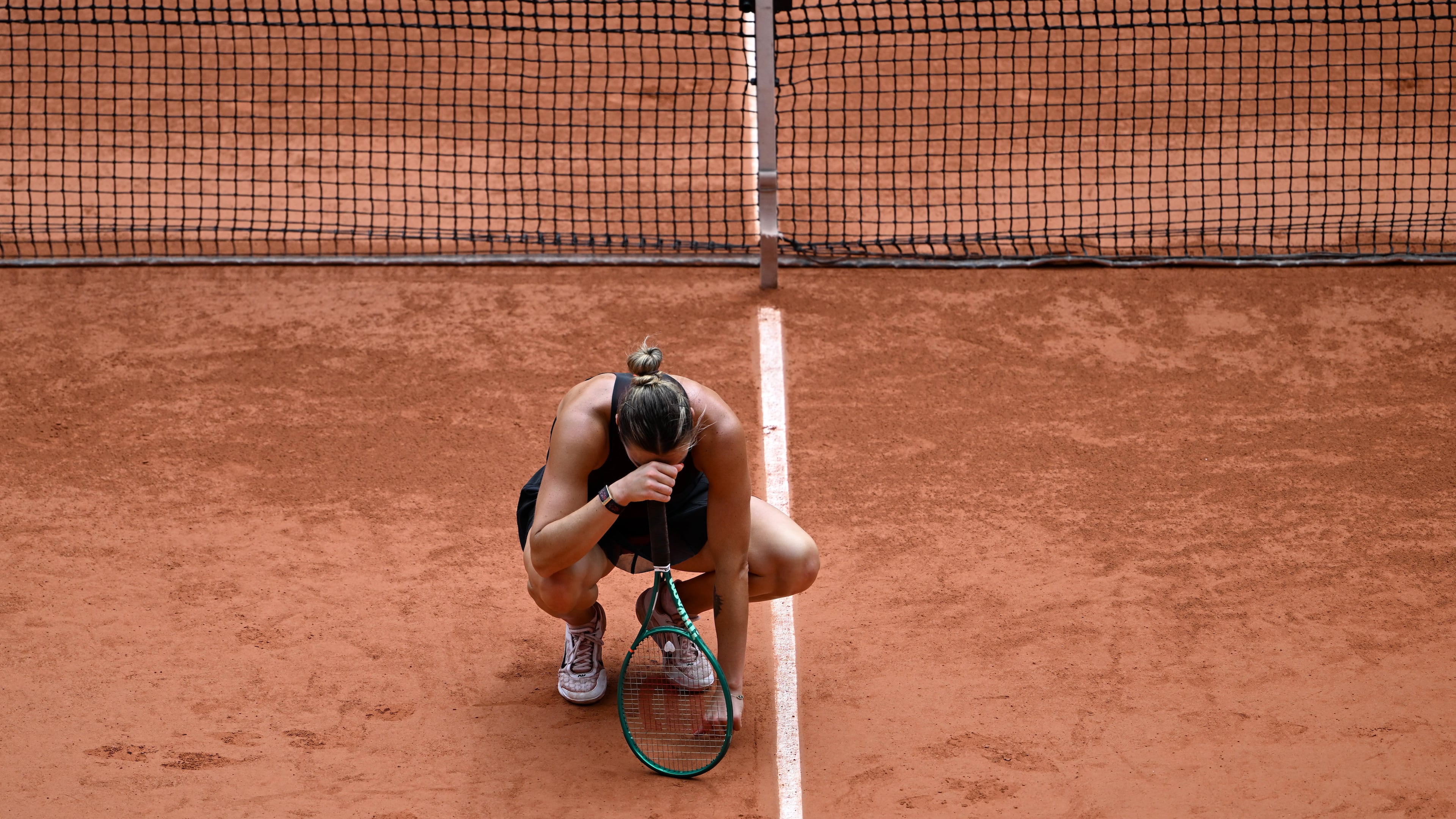 Aryna Sabalenka of Belarus reacts after losing the quarterfinal tennis match against Russia's Diana Shnaider at the French Open in Paris, Wednesday, June 3, 2026. (AP Photo/Emma Da Silva)