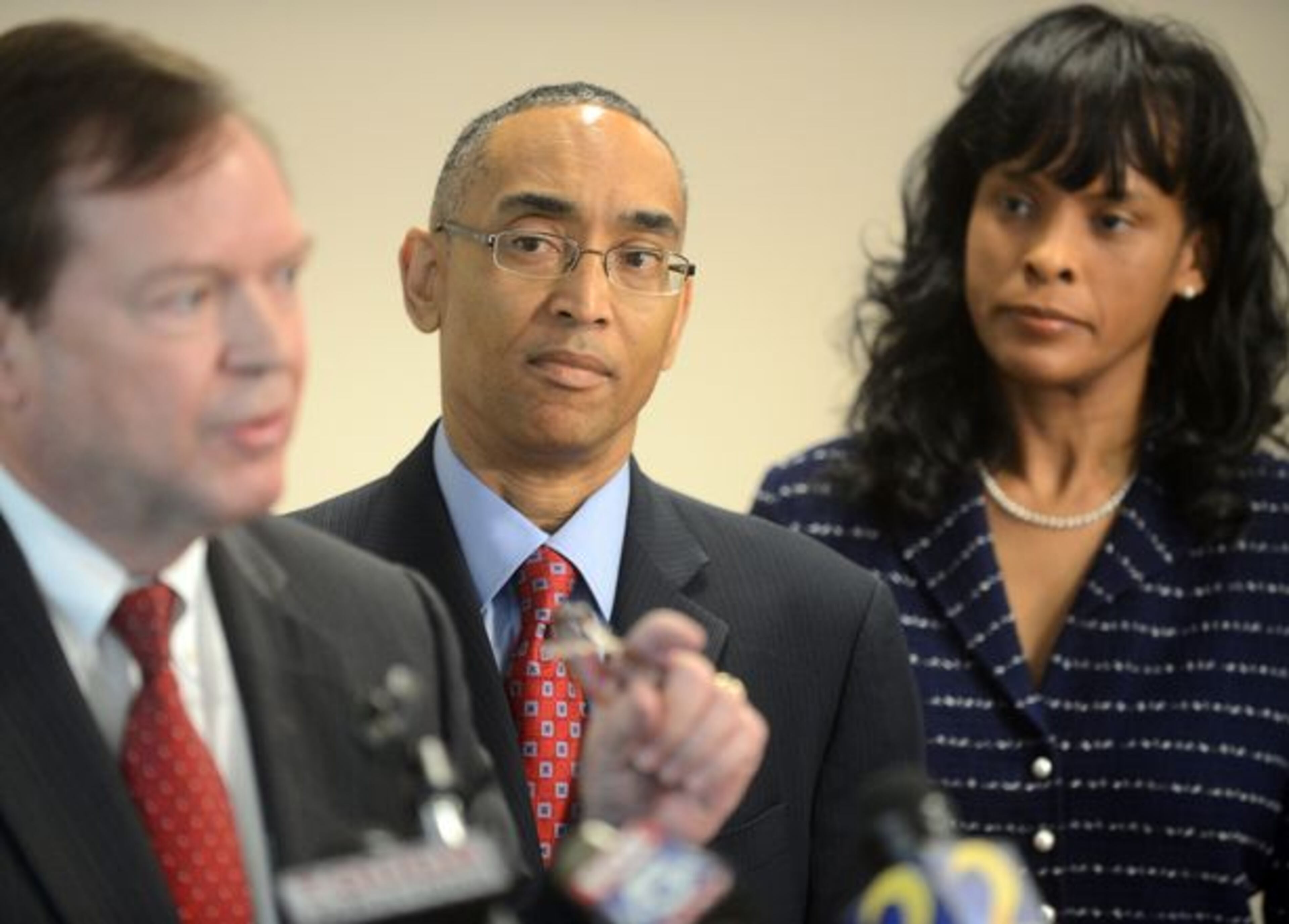 As the probe continued, DeKalb CEO Burrell Ellis hired attorney Attorney Craig Gillen, who spoke during a press conference as Ellis and his wife, Philippa, listen Thursday, January 17, 2013 in Decatur.