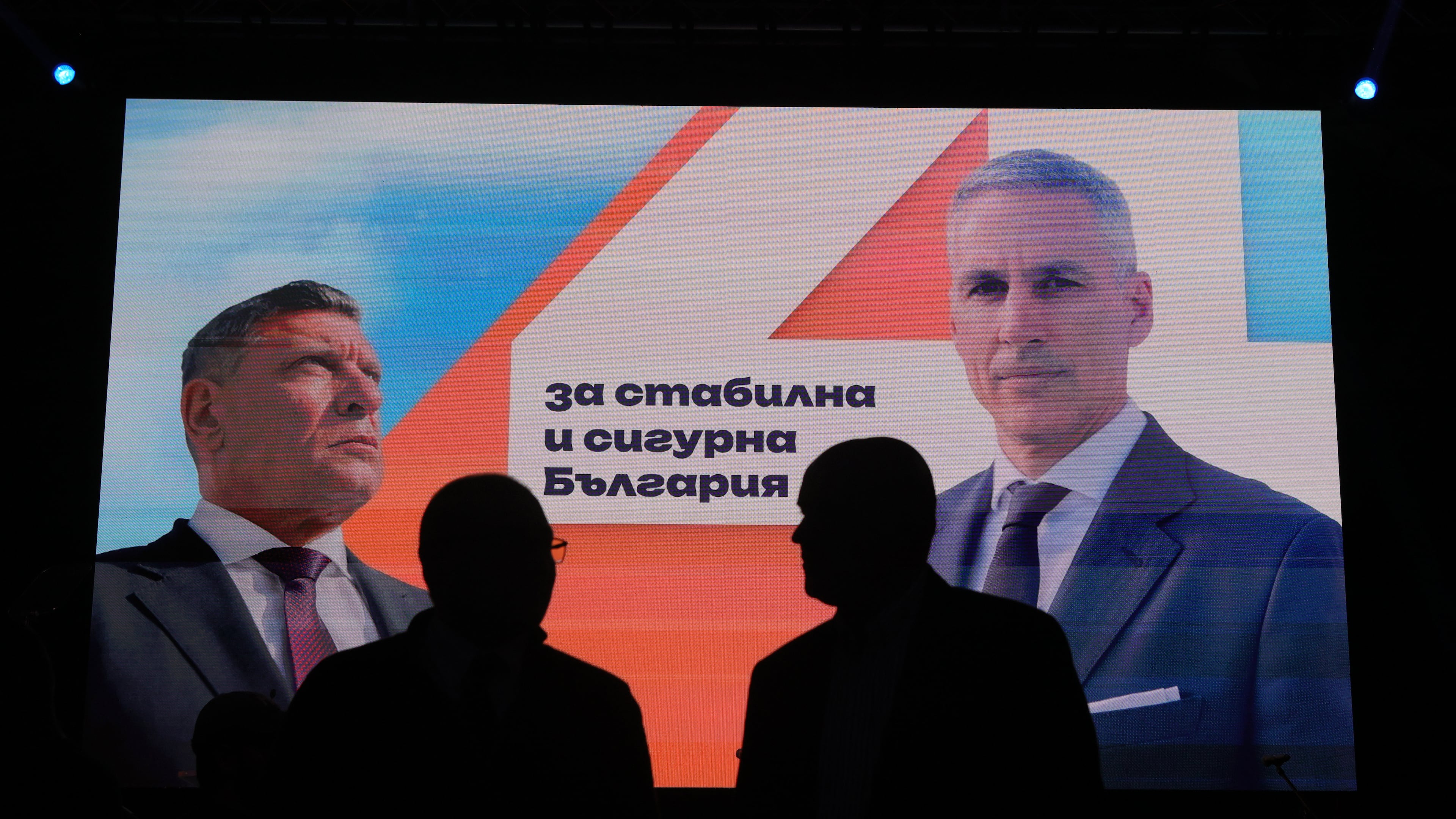 Posters featuring independent presidential candidate Andrey Gyurov and his vice-presidential running mate, Georgi Kandev are displayed on screens during their campaign's closing event in Plovdiv, Bulgaria, on Oct. 21, 2026. (AP Photo/Valentina Petrova)