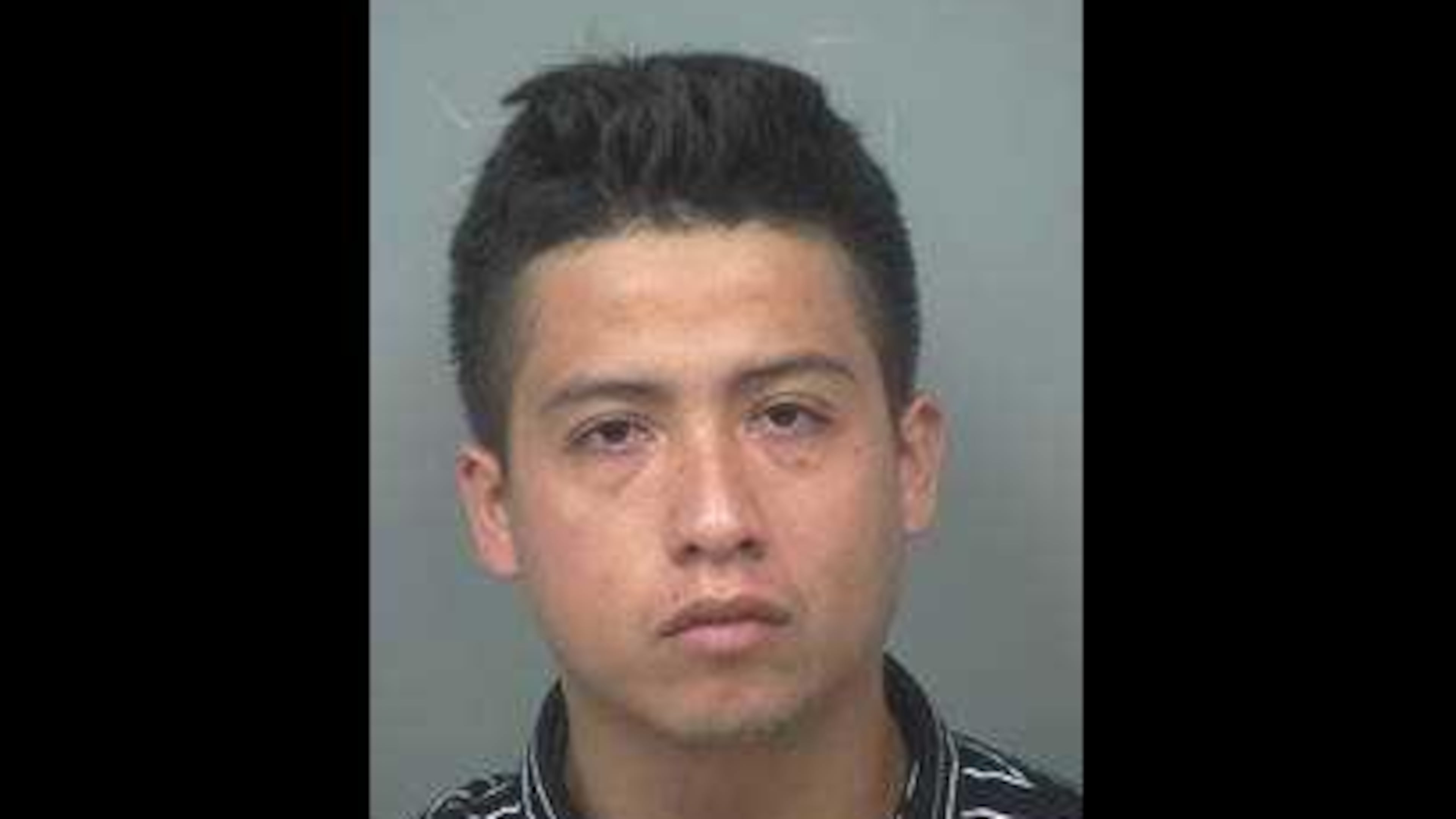 A mug shot of Hiker Rios, who is charged with first-degree cruelty to children and felony murder in connection with the death of his 2-month-old baby daughter.