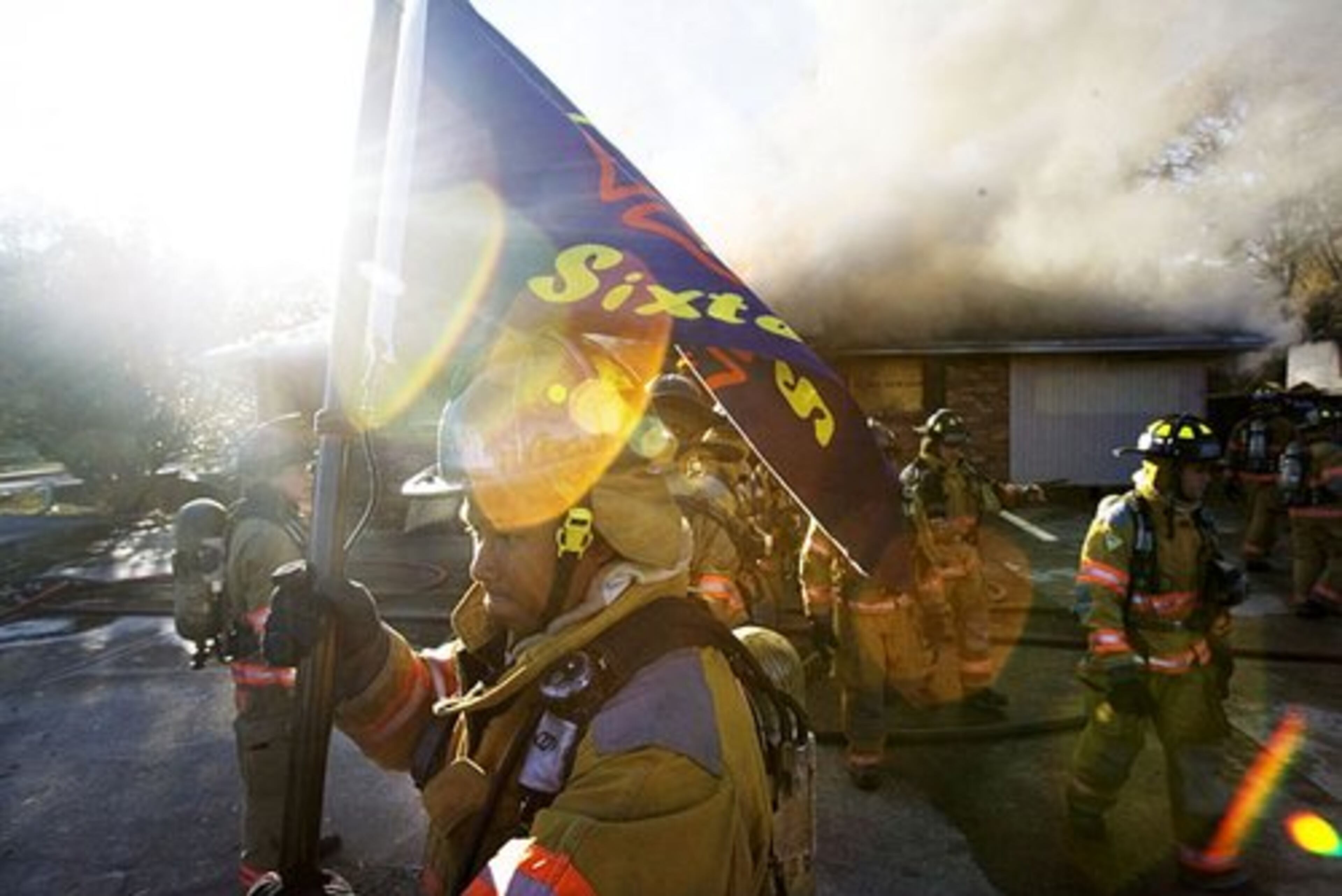 The class has their own flag, which says "Extreme Sixteen" on it. The recruits practiced in teams of four, taking turns battling the fires.